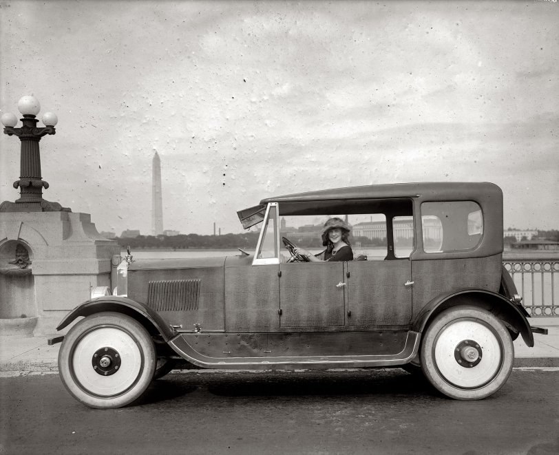 1921. "Margaret Gorman in Birmingham car." Whose reptilian body has an alligator finish. In 1921 Margaret was both the first Miss Washington, D.C., and the first Miss America. View full size. National Photo Company glass negative.
