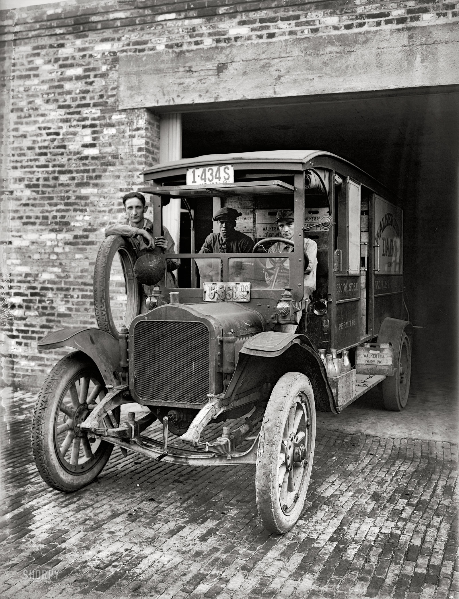 Washington, D.C., circa 1921. "Walker Hill Dairy." And a milk truck that's been around the block a few times. National Photo Co. glass negative. View full size.
