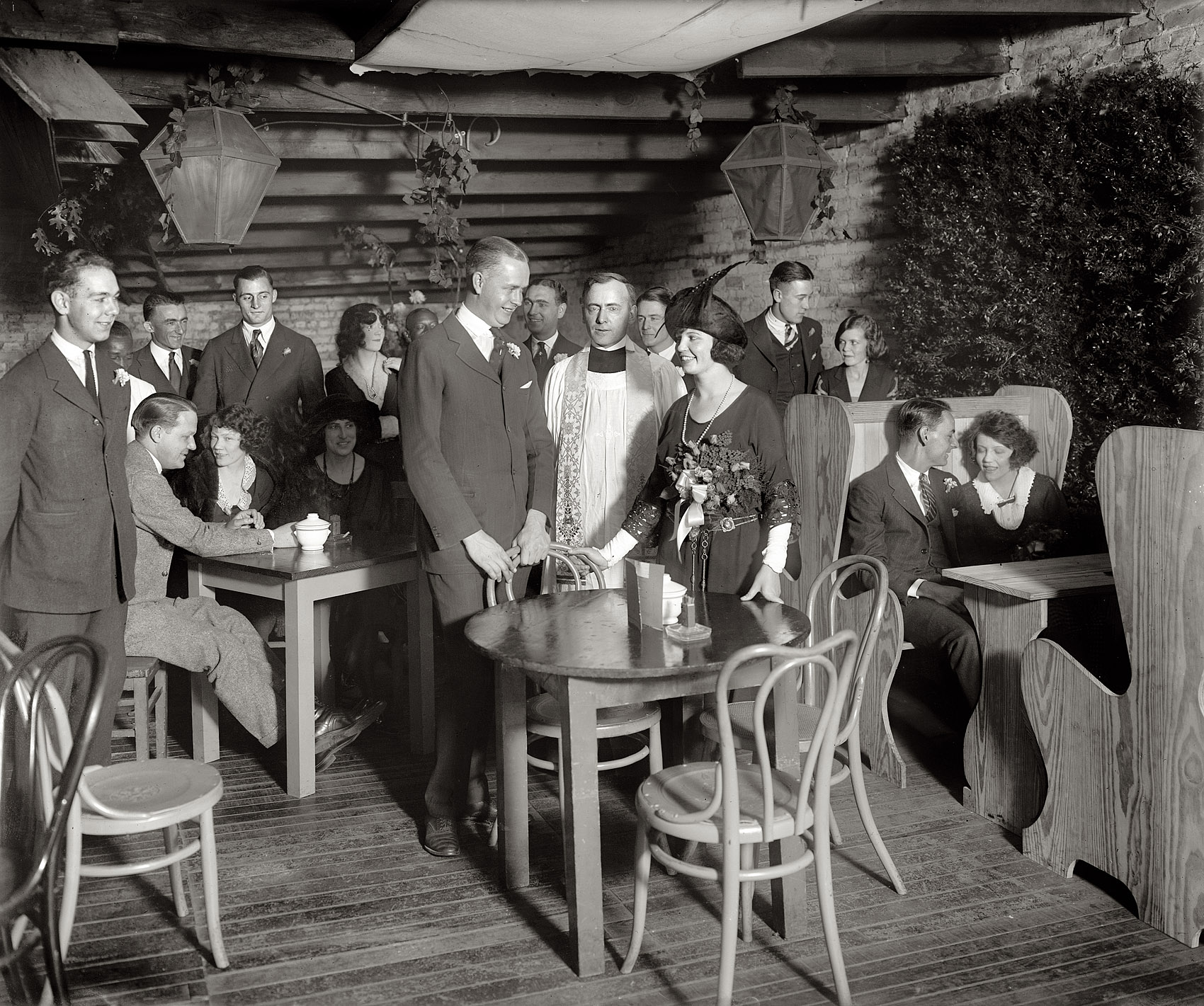 "Better 'Ole Wedding." Informal nuptials circa 1922 at the Better 'Ole, a Greenwich Villagey "bohemian" nightspot in Washington, D.C., that, while short-lived, made its mark. In 1935 the Washington Post called it  "the first real night club of the so-called 'night club era.' " The article continues: "It was started by Charles W. Smith, now the noted black-and-white artist, had a membership charge of $1 and was located on the second floor of a three-story building at 1515 U Street. A hot colored dance orchestra held forth in a room decorated with drapes in a sort of cubist style." More here. National Photo Co. glass negative. View full size.
