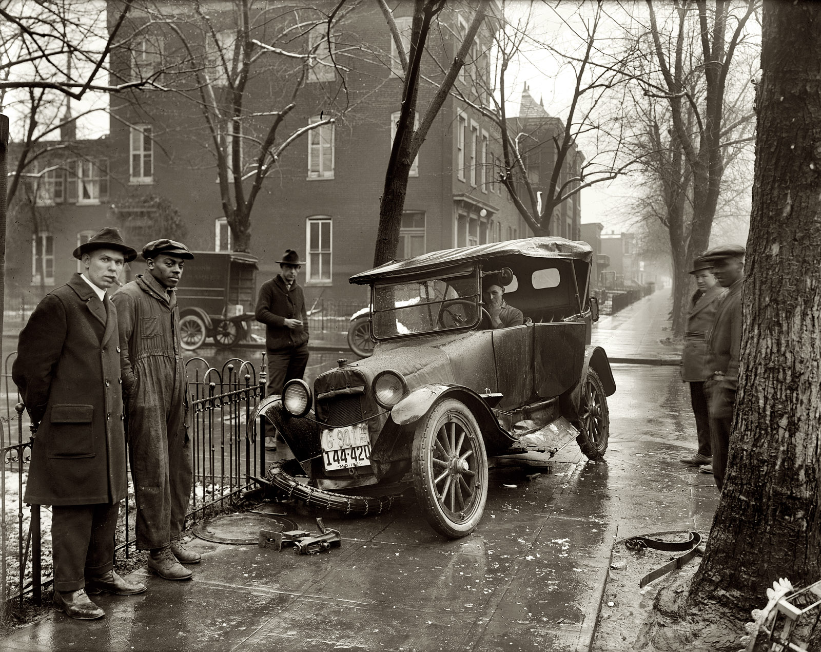 1921. "Auto wreck." Vehicular mishap on a wintry day on the streets (and sidewalks) of Washington, D.C. View full size. National Photo Company.