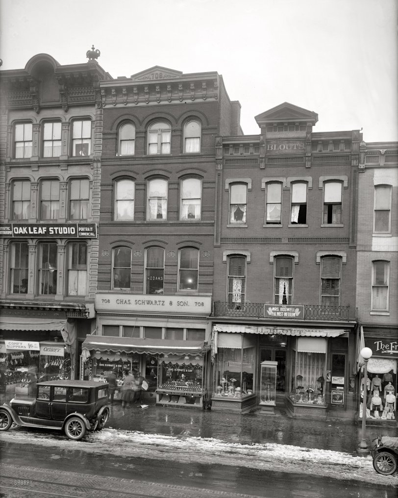 Washington, D.C., circa 1921. "Chas. Schwartz &amp; Sons Co., 708 Seventh Street." Flanking the jeweler, footwear from small to large, and a palmist-medium. National Photo Company Collection glass negative. View full size.
