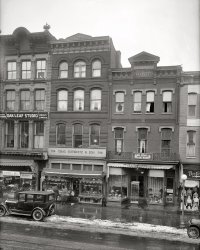 Washington, D.C., circa 1921. "Chas. Schwartz & Sons Co., 708 Seventh Street." Flanking the jeweler, footwear from small to large, and a palmist-medium. National Photo Company Collection glass negative. View full size.
