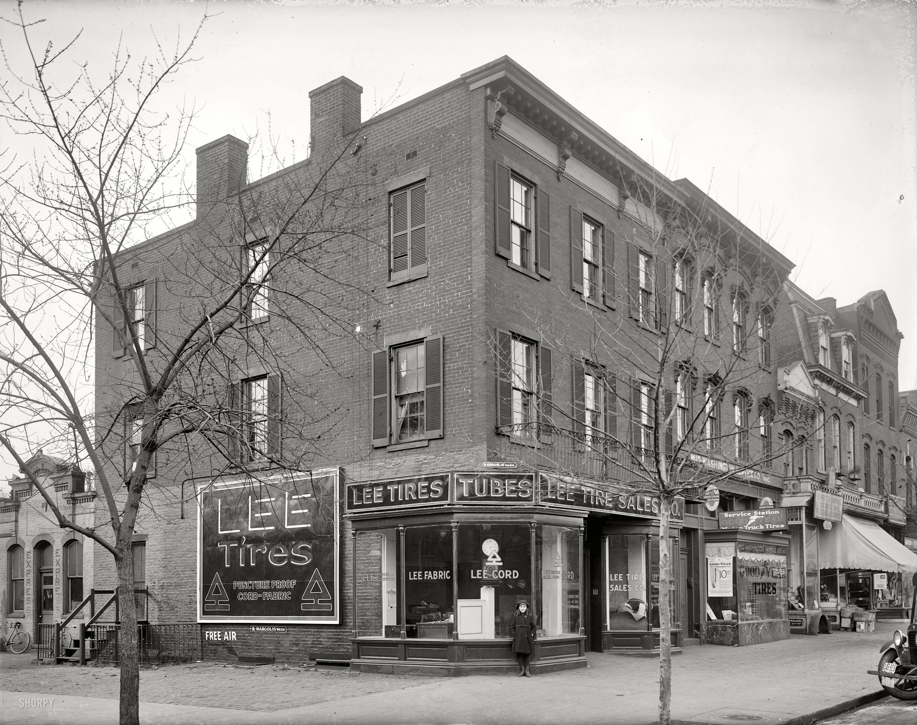 Washington, D.C., circa 1921. "Lee Tire Sales Co., exterior." A clutch of transport-related businesses on 14th Street N.W. National Photo Company. View full size.