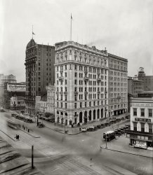 District of Columbia circa 1921. The Washington Evening Star building at 1101 Pennsylvania Avenue. National Photo Company glass negative. View full size.
YMHAOne of the reasons I like this site so much is that, each day, it expands this small town boy's horizons. Had never encountered the Young Men's Hebrew Association. After a little Googling, I now know more than I did yesterday.
FlagsI wonder why the flag on the Raleigh Hotel is flying at half mast. There's a lot to look at in this pic.
D.C. StreetcarsI'm digging the street cars moving down Pennsylvania Avenue.  I didn't know there were any.
There is a Fogo de Chao restaurant in that building now.  It was Planet Hollywood before.  The Hotel Harrington is still there too.
Washington StarThis picture is stirring a few memories.
My father started working summers beginning in 1967 when he was pursuing a post-secondary education at American University. He liked the job enough that he stayed after graduating. It was at this time the Star had some colorful events. He also went on strike with a few other coworkers. He was hired by the Washington Post when Star declared bankruptcy. I went to his workplace a few times when I was a kid. I can still smell the ink...
Washington Post in your face billboardIt is interesting that the Washington Post placed a billboard advertisement opposite their competition. 
The visitors to this site frequently cite the Washington Post to clarify items in these photos; it is a shame that the Evening Star closed before its archives were digitized.  The Star, an afternoon paper, predated the Washington Post and would be a valuable source of information about early Washington.
[Being out of business is no obstacle to a newspaper's being digitized. Hundreds of defunct old broadsheets from the 19th and 20th centuries are online in various archives. - Dave]
Digitized DC papersFor some more trips to Washington, DC of the past the Library of Congress has their Chronicling America.  
http://www.loc.gov/chroniclingamerica/index.html
Only covers 1890-1910 but there are some interesting DC area papers. You can see old real estate development ads and often there are pictures of the "new" developments like Petworth and "Saul Addition."
There are full-text database like "19th Century Newspapers" (Gale), which has US Telegraph, Washington Globe, Daily National Journal, and National Intelligencer. "Americas Historical Newspapers" which has 27 title for DC including the Washington Gazette, Globe, Washington Federalist, Daily National Intelligencer, Federal Republican, etc.
The Washington Star photo archiveWhen they closed, they gave their archive to the District. I forget which branch it is. But there are several file cabinets full of photos.
Remember the Star well!I read the Star years ago when I lived in D.C. (1960's) and it was the best. The other one I just loved was the Washington Daily News. Small paper but had lots of fun articles and games. Irony is my father worked for the Washington Post, he just loved it there, but the Post was always huge, and I could never really get into it.
I still live near DC, and miss the DC of the past so very much.
I used to also ride those streetcars mentioned here, and they were wonderful. They were cheap and fast. We lost the best of D.C. when they removed them.
I also remember when Washington was like any other small town, and believe it or not, it was actually a small town up until around the mid 60's. Neighbors hung over fences and talked about the Lincoln Roses they were planting, and yes, every yard had them. Entire streets were blocked off for ball games, hide and seek, and you played outside until very late in the summertime. Everyone sat on porches and watch the world go by. It was a fantastic City. (And still is)
Evening StarI worked for the Star as a newsie and a jumper, even tho I didnt know we were called newsies.  The best part was winning contest and going to KFC.  Didn't take much to please us.
Washington Star &amp; streetcarsThe Martin Luther King Memorial Library, a public library in downtown DC (a Mies van der Rohe Building) houses the paper archives in their Washington Room.  Regarding streetcars, they might be coming back!!!
More on Evening StarThis is like old home week.  I worked at the Washington Star, and later at the Post. The MLK's Washingtoniana section does have the card index from the Star, though this is by categories, with chronological entries, and the categories change through the years. It is from 1906-the seventies, maybe.  Can't remember for sure. I think the plans to digitize the Star fell through for now, the last I heard. I believe that the Washington Post building may have been where that sign is.  I think I've seen it on the Avenue in early pictures. As a native Washingtonian, albeit displaced, I love these old National Photo pictures especially.
Evening Star FamilyI lived in Prince Georges County and we were not rich financially but my Father GOD Bless him provide for all the kids at Home. but we were rich in lovin life and havin fun when we were kids!
It was not hard to find a way to enjoy any and everything in my small world!
The Seasons in the Wasihington,D.C. area were always spectacular!
Goin to the drug store and getting ten cents worth of candy in a brown paper bag that would last you a whole entire day!
 I became a newspaper boy and then I was rich goin down to the "Drug Fair" and getting a half smoke,soda,and a bag of chips for sixty cents,no tax.
Would so love to hear from others who worked at Evening Star in mid 1960's and or newspaper boys who worked around the same time1
I was blessed to know good people who held positions in the newspaper world of The Evening Star
(The Gallery, D.C., Natl Photo)