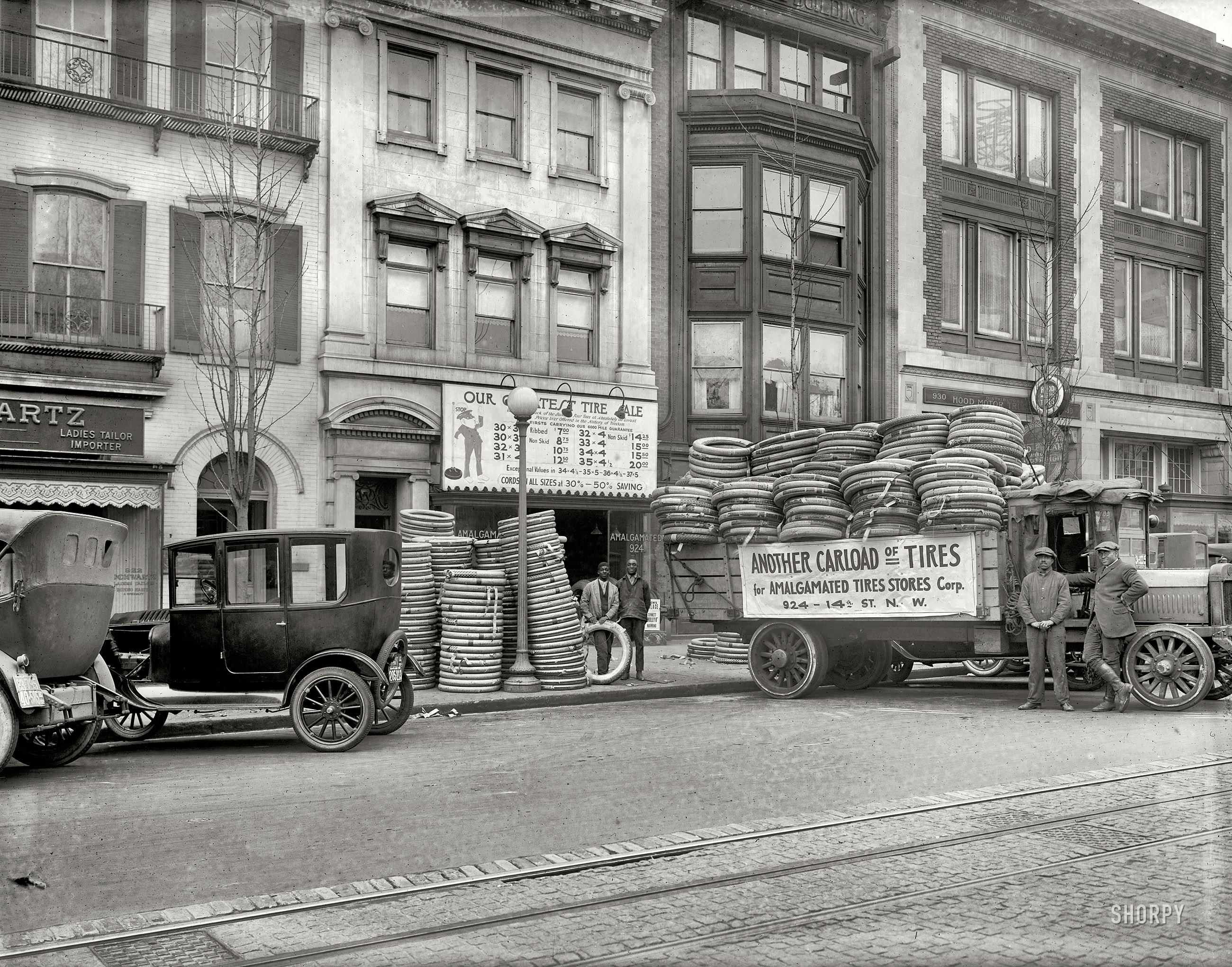 Washington, D.C., circa 1922. "Amalgamated Tires, 14th Street N.W." Hurry on down for our BIG SALE! National Photo Co. glass negative. View full size.