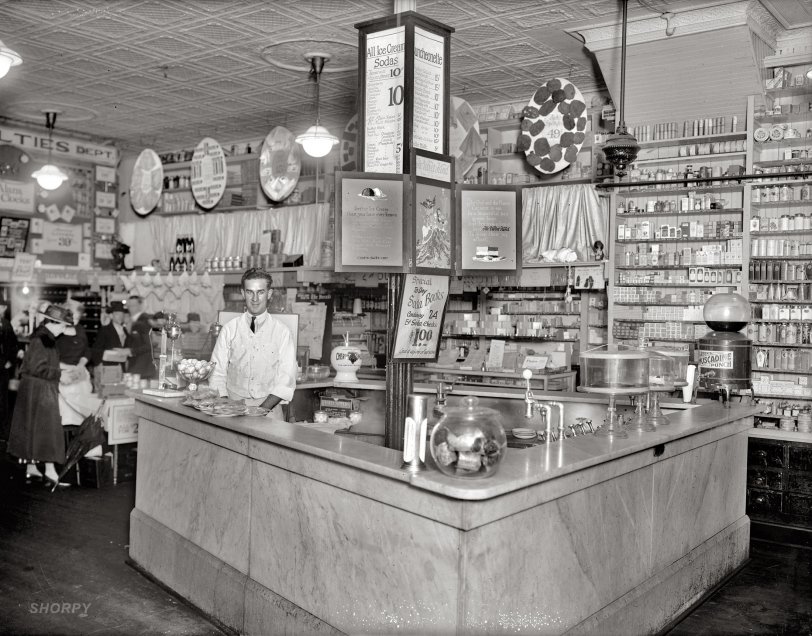 "People's Drug Store, Seventh and K Street N.W." A Washington, D.C., soda fountain circa 1921. National Photo Company glass negative. View full size.
