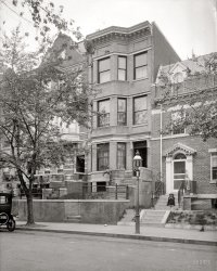 Washington, D.C., 1922. "1859 California Street." National Photo Co. glass negative. (Update: This house is on the market for $1.55 million.) View full size.
Almost untouchedStill there, and besides being a bit weatherbeaten, nearly unchanged:

SpookyThat foot in the lower right corner is the creepiest "ghost" I've seen on Shorpy!
Ghost imageThe almost ghostly child is a little spooky, but the severed foot is downright creepy
SecurityThe neighborhood is looking more locked-down than it did then.
View Larger Map
Madeline, is that you?The child on the steps reminds me of Madeline, the hat seals it.  By the way, is that a shoe is the lower right hand corner?  It is a little fuzzy  and looks a little strange.  An effect due to shutter speed but it makes me wonder how many ghost photo sites would classify this as paranormal.
Inspect This House


Inspect This House
OPEN
1859 California Ave.
Washington Heights
Few houses in such perfect condition
FOR SALE OR RENT

12 rooms, two (2) baths, servants' toilet; modern heat, electric lights; room for stable on lot.  A bargain for someone.

STONE &amp; FAIRFAX
1342 New York Ave.


Washington Post, Feb 13, 1916 


Admiral G.B. Harbor becomes the owner of 1859 California street, the property having been transfered from Mrs. Lucy P. Chambliss.

Washington Post, Apr 17, 1921 


Mystified!It appears she is barefooted since there is no color of the shoes. But she is dressed for an occasion. Are the shoes then all white, including the buckling? But I am mystified by the flatness starting at the ankle and downward. 
[Since we can see only as far as her ankles, it's impossible to say. - Dave]

Where in the worldWas there room for a stable on that lot?
[Stables and garages would be at the rear. - Dave]
AgreedBut how in the world would they get there? I know some places had "alleys", however on this street I see no cut throughs.
[The alley is the street behind the houses. - Dave]

This very house for sale todayJust a few e-mails down in my Inbox today from the Shorpy e-mail that included this picture was an EveryBlock e-mail that included this "For Sale" announcement.
Too bad the 90-year-old for sale ad doesn't list a price, for comparison purposes...
I can&#039;t explain why a shoe would just be sitting there are the sidewalk but what appears to be a leg is a stain on the curb behind the shoe.
[The shoe in this time exposure belongs to someone walking down the street. There's also a hat. - Dave]

1859 CaliforniaAs you can see by the realtor's post, this house has been completely redone since the Google Street View was snapped.
The Street View reflected the very poor state of the place due to an elderly woman living alone who unfortunately could not maintain the property.  (Yes those are plastic bags in the windows.)  I understand that a nephew finally came from out of town to help her move elsewhere.
DC Real Estate recordsPer DC Real Estate records, 1859 California St. 
sold on 2/27/09 for $625,000.00. Assesed at $753,050.00 in 2008/2009 
Property Features
 Building Type    	   Row Inside
Building Style 	3 Story
Living Area 	3,201
Year Built 	1909
Bed Rooms 	5
Bath Rooms 	2
1/2 Bath Rooms 	1
Total Rooms 	10
Wall 	Common Brick
Floor 	Hardwood
Heat 	Hot Water Rad
Air Conditioning 	None
Fireplace(s) 	2
That&#039;s not MadelineIt's the Morton Salt girl.
AfootIt's odd that all of the person would be such a blur, save the shoe; while walking, the feet move more than anything else. So that is indeed one of the stranger "ghosts" on Shorpy.
[It's the other way around -- in a time exposure of someone walking, the foot is the one part of the body that slows down long enough (at footfall) to show up. The rest of the body is in continuous forward motion. Which is why there are so many disembodied feet and legs in street photography from the era. Dozens on this site alone. - Dave]

Open HouseThe house was open yesterday, and it's gorgeous.
I live on the same block, and it was just really nice to see the house saved.  The old lady who was living in the shell you see in this photo was clearly not able to take care of it any longer.  It was a very sad situation.
My Old NeighborhoodI lived at 1863 California Street up until a few years ago and new the owner, Mrs. Miles, who said she was born in the house, when it was owned by her father.  She used to fall asleep on her "sitting porch" on hot summer nights and said it was a common practice when she was young.  
Unfortunately, Mrs. Miles was not able to take care of the house or herself toward the end.  The city removed her from the property and I guess it went up for auction.  Wherever she is, I hope Mrs. Miles is doing okay.  Sweet old lady.
(The Gallery, D.C., Natl Photo)