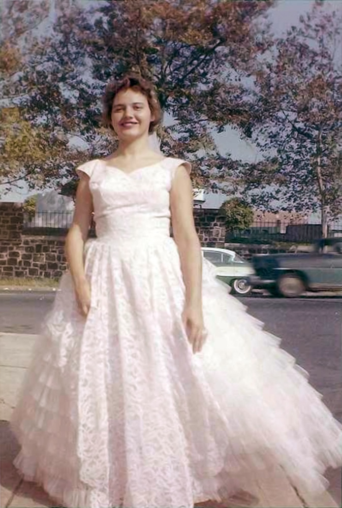 Aunt Eilleen, my father's older sister, dressed up for a high school dance in August 1958. She is standing at the corner of Noble and Conkling St., Baltimore, Maryland. She was married and had no children. She was employed by Goodwill Industries, retiring after 40 years of service.