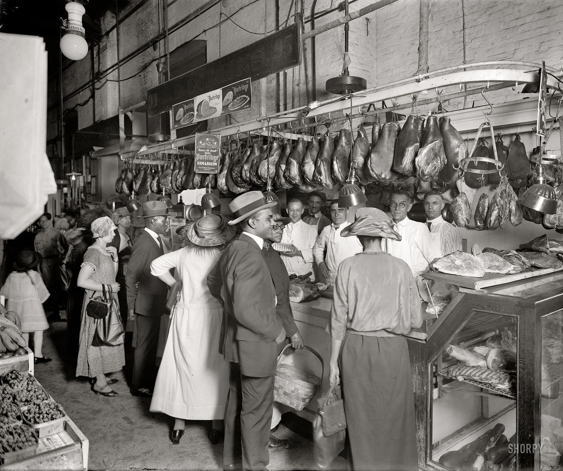 "D.D. Collins." Another circa 1925 scene from the O Street Market in Washington. Who wants ham? National Photo Co. Collection glass negative. View full size.