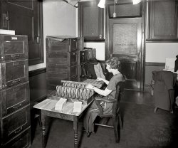 Washington, D.C., circa 1922. "National Assorting Co." The office of one Everett G. Clements. National Photo Company Collection glass negative. View full size.