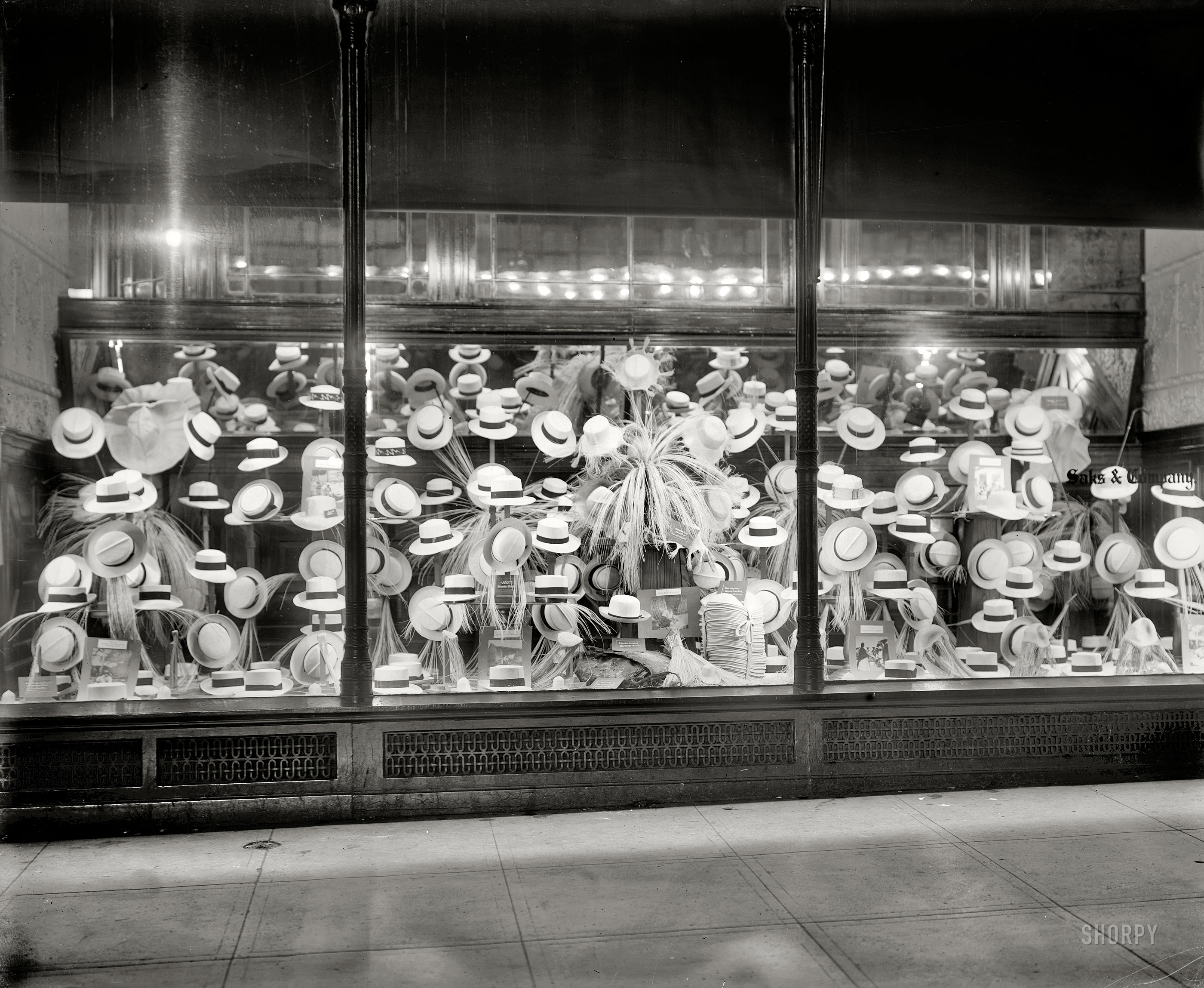 Washington, D.C., circa 1919. "Hat display, Saks & Co." Panama hats, and how they're made. National Photo Company Collection glass negative. View full size.
