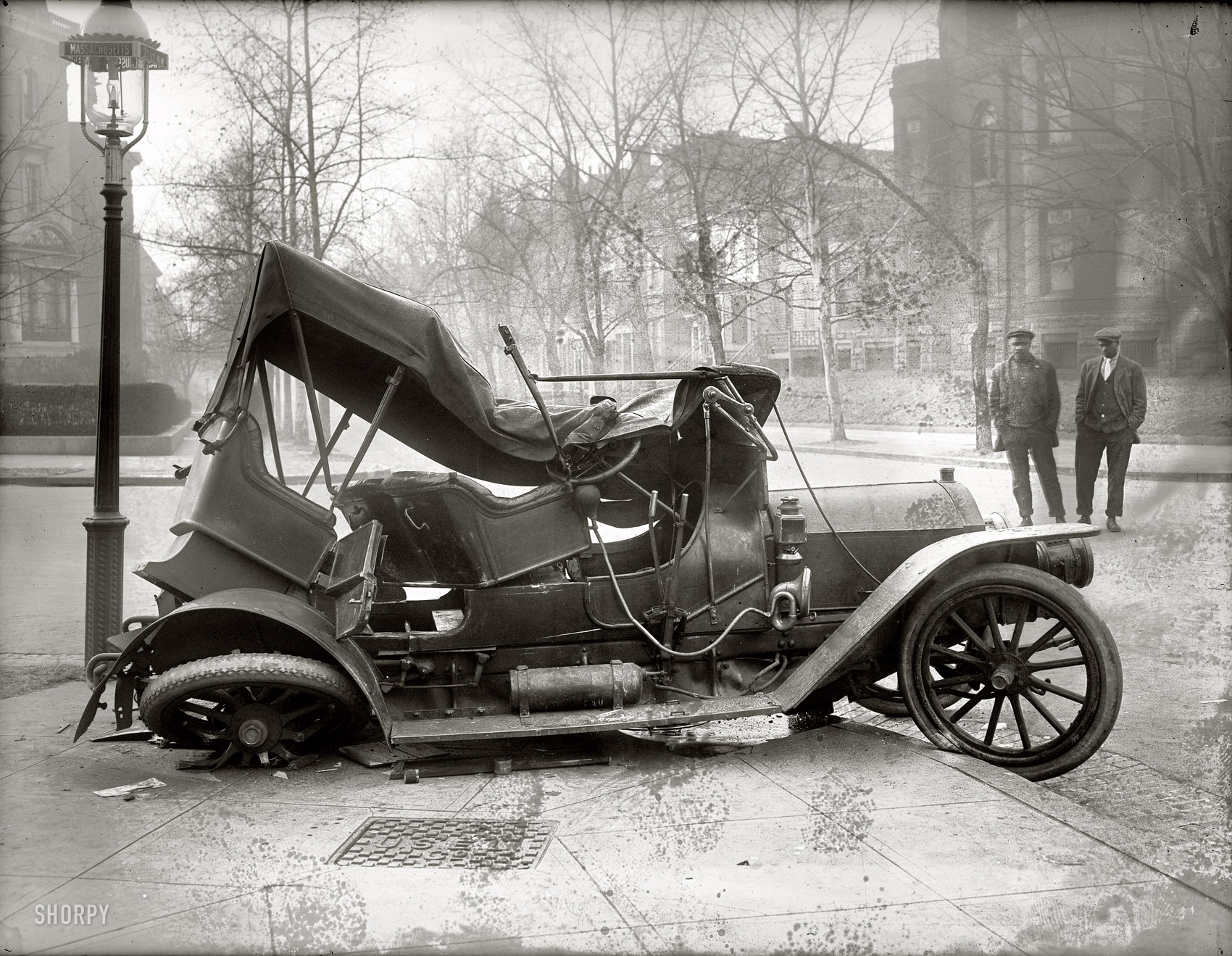 Our third look at that circa 1917 car wreck at Massachusetts Avenue and 21st Street N.W. in Washington. As with so many of these old glass negatives, mold is colonizing the thicker parts of the emulsion. The result is an accident scene that looks like it's been dusted with flour. National Photo Company. View full size.