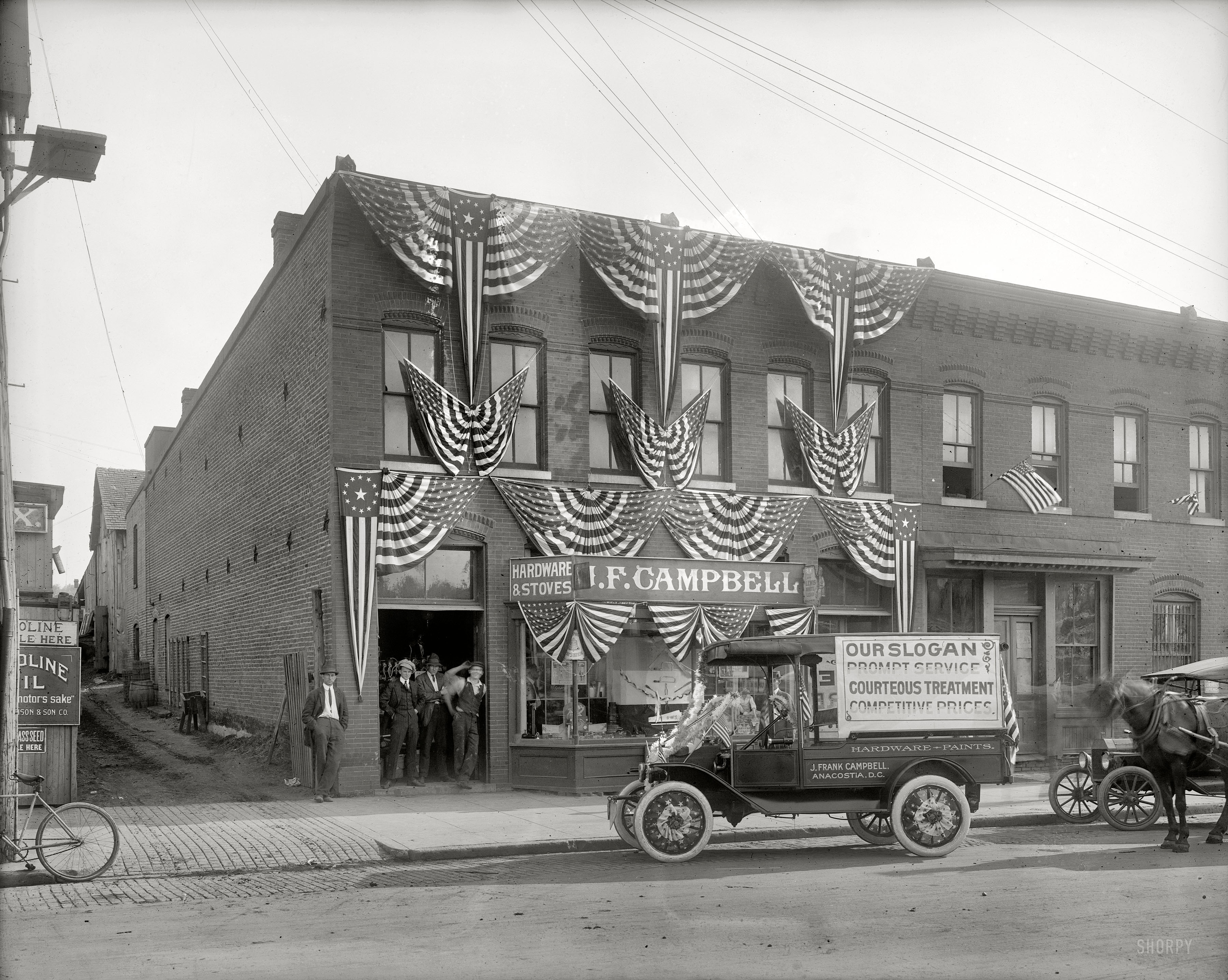 "J.F. Campbell, Anacostia, decorated with American flags." Circa 1918, another patriotically attired hardware store in Washington's Anacostia neighborhood. Check out the Mad Hatter. National Photo glass negative. View full size.