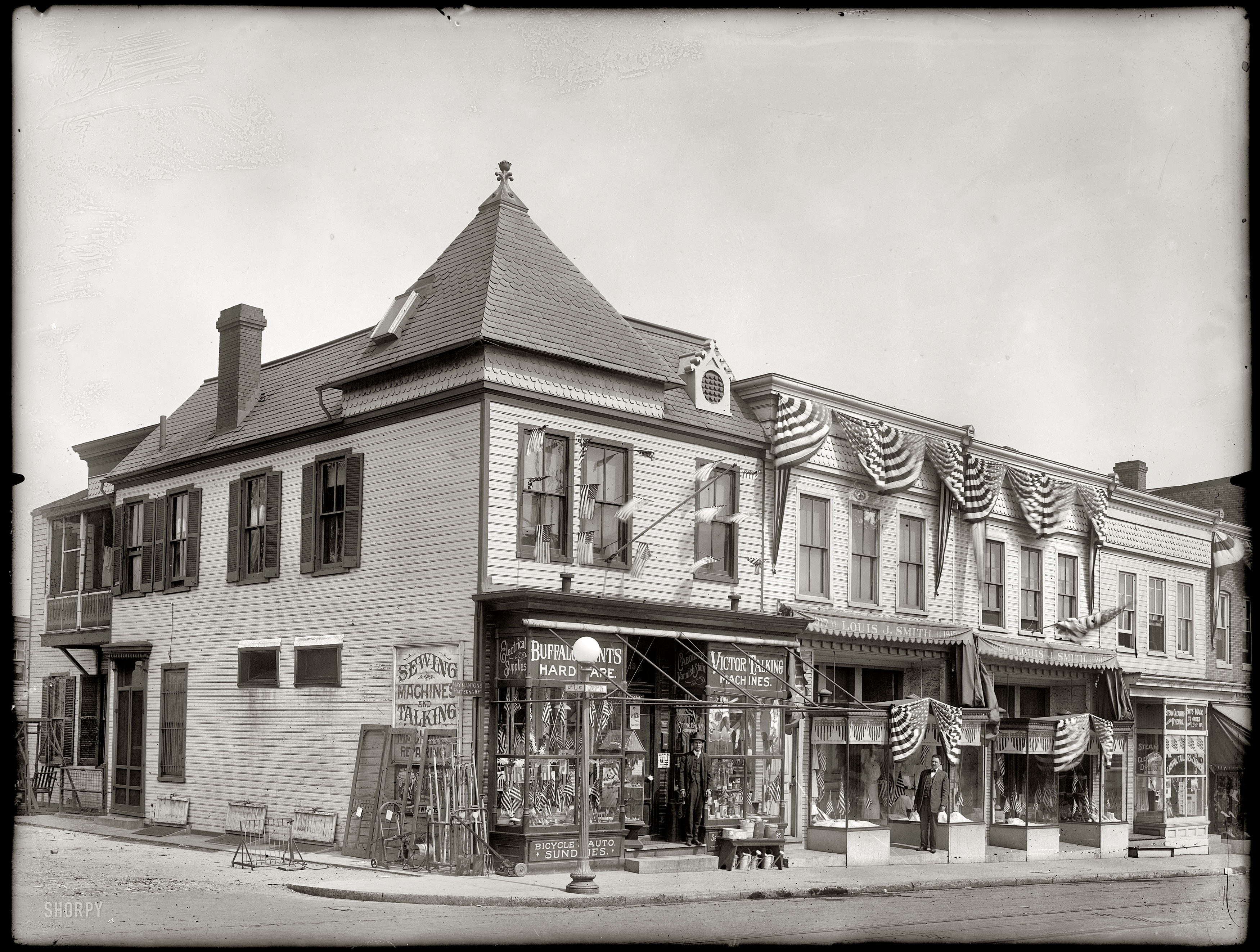 "Nichols Avenue and U Street S.E." Storefronts in Washington's Anacostia section put on a patriotic display circa 1918. The hardware store on the corner, at 1919, was run by one William Ira Mushake. Nat'l. Photo glass negative. View full size.