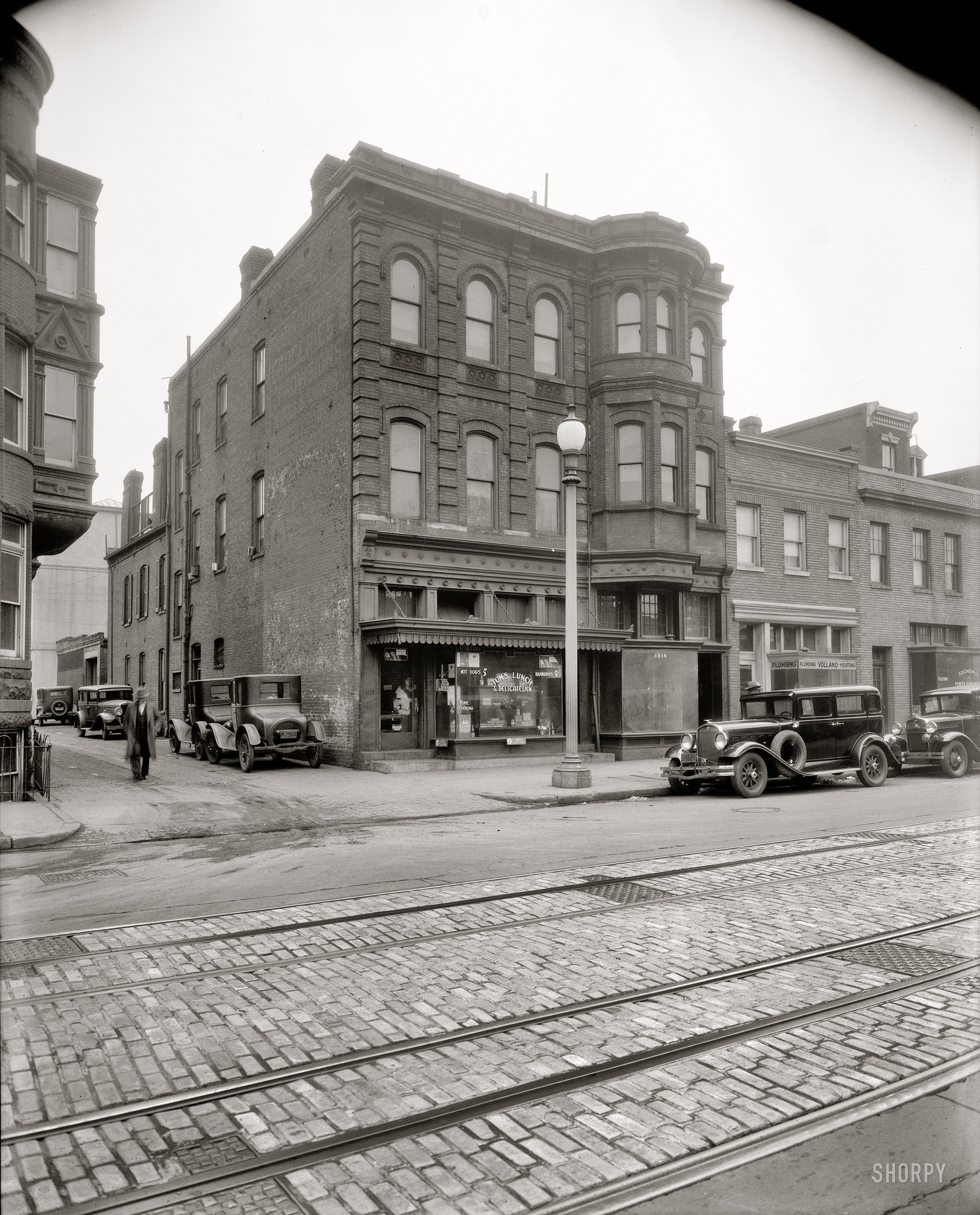 Washington, D.C., circa 1930. "Store front, 9th Street N.W." Hey lady, it's safe to come out. National Photo Company Collection safety negative. View full size.