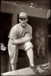 Chicago White Sox centerfielder Oscar "Happy" Felsch in 1920, his final season in the majors before being banned for life for his role as one of the "eight men out" who fixed the 1919 World Series. View full size. Geo. Grantham Bain Collection.
Notice the player in theNotice the player in the background. His uniform is filthy. Charles Comiskey, owner of the White Sox, was so cheap he made the players launder their own uniforms. The players resented this and often played in dirty uniforms. Because of this, the White Sox were sometimes called the "Black Sox" even before the scandal of the thrown World Series of 1919.
Also...The guy in back is also adjusting his fly...  
Hap FelschFelsch was portrayed by Charlie Sheen in John Sayles' film version of "Eight Men Out." Good flick -- check it out. John Cusack and D.B. Sweeney were in it too, and even Studs Terkel had a cameo as a newspaper reporter.
HappySo named because his mournful visage belied his sobriquet.
Happy the ComicAs a young kid in the 50's, I remember Happy standing in front of the bleacher fans at Milwaukee County Stadium during Braves games.  Back then the bleachers were truly bleachers.  Happy would put his baseball cap on sideways and pitch to an imaginary batter. Always on his last pitch, he would raise his head to the sky and follow the imaginary ball out of the park.  All of the bleacher fans (adults and kids) would get a huge laugh out of the skit every time he performed it.  It wasn't until many years later after watching "Eight Men Out" that I learned he was a former major leaguer and had been involved in the White Sox scandal. Great memory.
I remember too that his hand was always shaking.  He might have had Parkinson's disease. 
I am a Felsch too....It is a pretty rare name in fact I have never met another Felsch outside of my family. At any rate my father used to joke about being related to Happy and I must admit I resemble the man in the picture. Who Knows?
Kin to HappyHappy Felsch was my great-great-great uncle, and he went to his grave saying he didn't throw the game.
Happy&#039;s graddaughterI'm Oscar Felsch's granddaughter. He was a great and kind person. You're 100 percent correct. He was never involved. On his deathbed, he told my dad the facts. He will always be a great and honest player to us, his family.
I too am a FelschHap was my father's great-uncle. Anyone out there that would like to get in touch pls email me at beautiful.dysaster (at) yahoo.
Happy memoriesI remember a Happy Felsch attending Emmaus Lutheran Church in Milwaukee.  He was (as I recall) first in line to get World Series tickets in 1957.  We lived near the church and he was always nice to all of the kids at the school.  His hands shook all the time.  My dad always told me he was not THE Happy Felsch, but a relative.  Was Dad mistaken?  Did I really know THE Happy Felsch?
(The Gallery, G.G. Bain, Sports)
