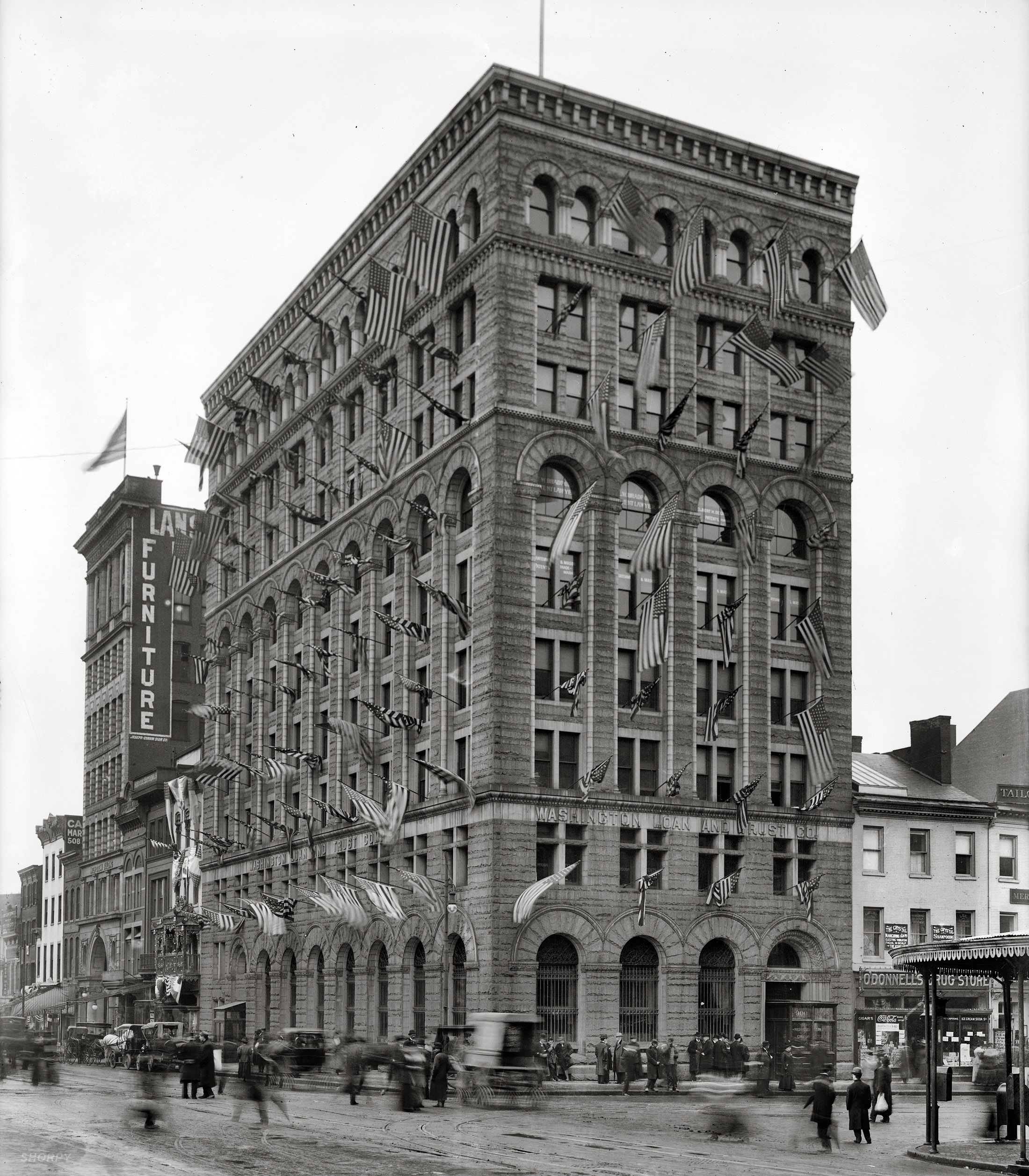 "District of Columbia. Washington Loan & Trust building." A street scene circa 1907, possibly on Flag Day. National Photo glass negative. View full size.