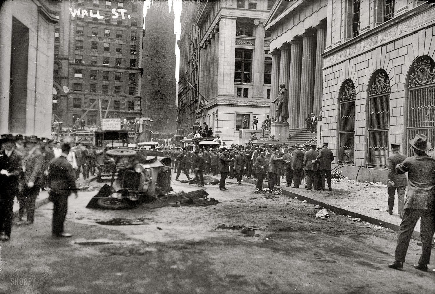 "Wall Street bomb." Aftermath of the explosion that killed dozens of people in New York's financial district on September 16, 1920, when a horse wagon loaded with dynamite and iron sash weights blew up in front of the J.P. Morgan bank at 23 Wall Street. The attack, which was attributed to Italian anarchists, was never solved. 5x7 glass negative, George Grantham Bain Collection. View full size.