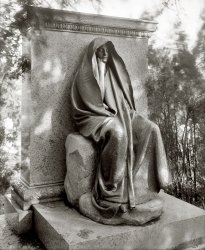 Washington, D.C., circa 1915. "Grief monument, Rock Creek cemetery." Augustus Saint-Gaudens's ambiguously enigmatic bronze memorializing Clover Adams, the society hostess whose suicide led to its commission by her husband, the writer Henry Adams. National Photo Co. Collection glass negative. View full size.
&quot;TMOTHATPOGTPU&quot;Saint-Gaudens's name for the bronze figure is The Mystery of the Hereafter and The Peace of God that Passeth Understanding, but the public commonly called it Grief—an appellation that Henry Adams apparently disliked. In a letter addressed to Homer Saint-Gaudens, on January 24, 1908, Adams instructed him:
    "Do not allow the world to tag my figure with a name! Every magazine writer wants to label it as some American patent medicine for popular consumption—Grief, Despair, Pear's Soap, or Macy's Men's Suits Made to Measure. Your father meant it to ask a question, not to give an answer; and the man who answers will be damned to eternity like the men who answered the Sphinx." -- Wikipedia
I remember studying this in college and the ambiguity of the figure sent critics of the time into a tizzy. The lesson ultimately learned was the critics filled in the blanks with their own personal baggage and interpreted the meaning incorrectly.
What&#039;s In Your Wallet?Grief.
AwesomeI have lurked in the background for many months, but must break my silence to comment that this is one of best from an incredible collection.   It is haunting in many ways, but does speak volumes to the soul of this observer.  Thank you Shorpy for all that you bring to the light of those who appreciate the world of photography and the representated life from the past.
A Baltimore LegendA copy of this statue became the infamous "Black Aggie" here in Baltimore. 
http://www.prairieghosts.com/druidridge.html
Pop QuizThis monument made it into the history books, I believe I had to memorize a slide with it!
I know this is sad but....it kind of creeps me out!
The Education of Henry AdamsIn his famous autobiography, Henry Adams doesn't mention his wife at all, but he does talk about this statue without identifying its purpose.
BittersweetOh, but this is beautiful -- and the ambiguity works, too -- don't know if it was Henry or Clover of the personification of grief itself. 
Roosevelt tieIn her first stay in Washington (when her husband was Assistant Secretary of the Navy), Eleanor Roosevelt would spend hours meditating on this spot. Joseph Lash wrote in "Eleanor and Franklin" that she envied the peace reflected in the tranquil face of the statue. 
GriefGood heavens what a stunning work and remarkable bit of photography! I've been gazing at her at every opportunity for a day now, and have more questions about what she says now than I did yesterday. Is she still there?
[Yes. - Dave]
Lived with her (?) for 20 years.My Father was Superintendent of Rock Creek Cemetery and my family lived in a house within the gates. I can't count the times I've looked at this statue and wondered about the meaning of it.
Twelfth Night Shakespeare"A blank, my lord. She never told her love,
But let concealment, like a worm i' the bud,
Feed on her damask cheek: she pined in thought,
And with a green and yellow melancholy
She sat like patience on a monument,
Smiling at grief. Was not this love indeed?"
That's what comes to mind when I see this statue.
Give Me Good DirectionsWhile in Washington for the Inauguration, I drove all over the cemetery looking for this monument, which I first learned of in reading Gore Vidal's Empire.  I became a fan of John Hay, which led me to the other eponymous half of the Hay-Adams House, Henry Adams and his dynamos.
I would very much appreciate specific directions once inside the cemetery.  Thank you. Jeff Noble
[Click here. - Dave]
We&#039;ve met.This statue gave me the heeby jeebies when I first saw it.  I just happened to be riding through the cemetary. But I knew some great artist created it.  
FantasticalBeing a taphophile, I of course love this and want to photograph it myownself. Maybe someday.
Wow, I absolutely love this.And thanks to JennyPennifer for "taphophile." I always knew I was one, just didn't know the name for it.
(The Gallery, D.C., Natl Photo)