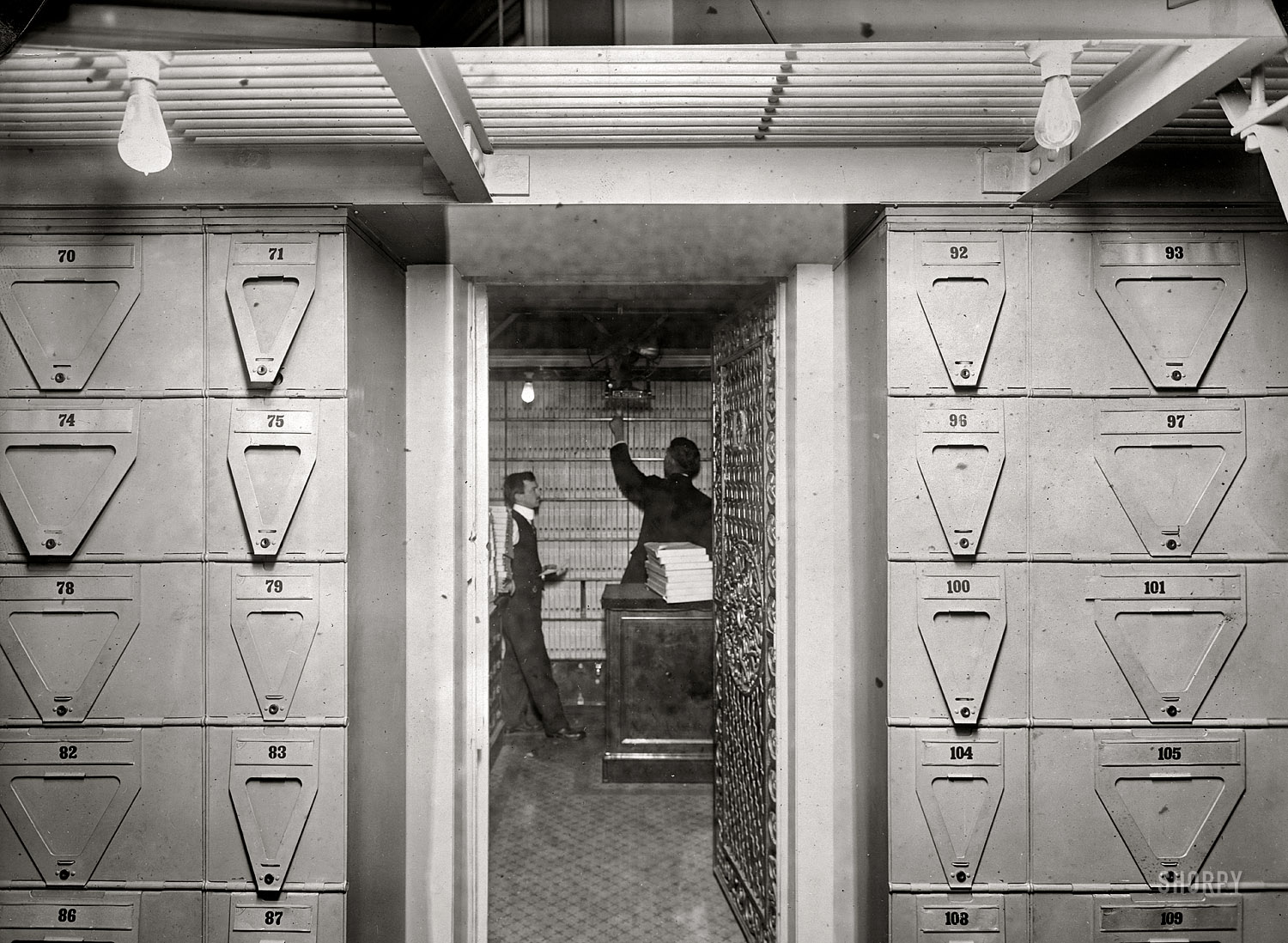 1914. "Treasury Department, Office of Comptroller of Currency -- bond vault. Contains bonds to the value of $900 million securing government deposits and postal savings fund." National Photo Co. glass negative. View full size.