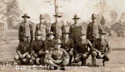 Soldiers of Battery E of the 314th Field Artillery at Camp Lee (now Fort Lee), Virginia.  They're getting ready to ship out to France in 1918. My grandfather is in the second row, kneeling down, third from the right. View full size.
(ShorpyBlog, Member Gallery)
