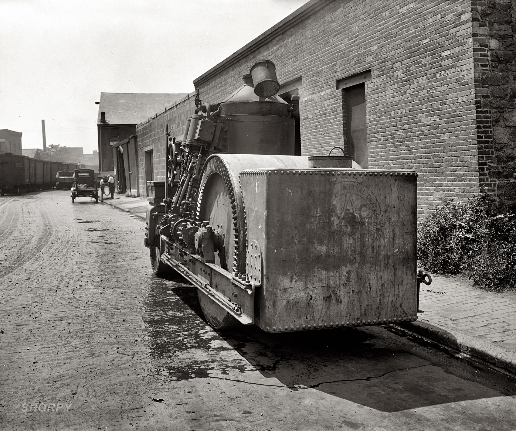 "Crawford Paving Co." The third and final image from this series showing a Barber steamroller circa 1925. National Photo Company glass negative. View full size.
