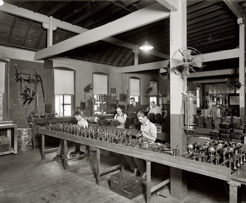 Handset assembly (or maybe rehabilitation) at the Chesapeake &amp; Potomac Telephone Company circa 1925. National Photo glass negative. View full size. Who can spot the clues that might tell us when this photo was taken?
