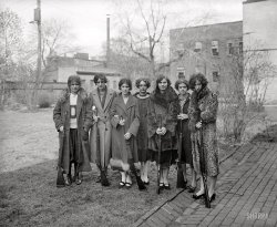 Washington, D.C., circa 1925. "Girls' rifle team of Drexel Institute." National Photo Company Collection glass negative. View full size.
By 1926The administration had decided that showing the twin-bill of "Annie, Get Your Gun" and "The Story of Lizzie Borden" was not a great idea. 
Ready on the Rightto wipe out the rest of the team! Looks like the fuse is VERY short!
Take cover, Men!"The Great Man Hunt" of 1925 is about to begin!
The Charlie Manson stare!Third from the left. Look out for her; she's on a mission. Not a particularly friendly looking bunch of gals. If you run into them on the street, smile, nod your head and KEEP WALKING!
Quoting Dusty Bottoms"Looks like someone's been down here with the ugly stick."
In today&#039;s PC worldYou don't often meet a woman who's shot her own wardrobe!
Firearm Safety...The second girl from the left has the bolt on her rifle closed. Not safe unless you're in a position to fire the thing.
Not Necessarily Unsafe......but not as safe as it could be.  I have a bolt action rifle with very similar bolts, and if the safety lever is in the "safe" position you not only can't fire the gun but can't work the bolt either to load a round.  Still, the preferred method is to have the bolt open (as most of them are) when the weapons are displayed in this manner.
One might argue that they are not all pointed in a safe direction either (which you do always, even if the bolt is open and there are no rounds in the magazine).  A couple of the ladies appear to have their rifles pointed right at their heads.
She won&#039;t take &quot;no&quot; for an answer.Before computer dating, it was not uncommon for the less attractive ladies to go out and bag a husband. She needed to be a good shot as not to render him impotant or feable minded.
Duct Tape?My gunnery sergeant would not have been happy with the material condition of No. 3's weapon.
SlinglessInteresting, none of these rifles have slings.
OriginalThe Original Broad Street Bullies.
Bolting AwayYou noticed the bolt on her rifle? What about the bolts in her neck???
Alaska huntress?This photo can open up many snarky comments but I have to ask if any of them ended up in Alaska, maybe hunting from an aeroplane?
And then there were six....I think, like the haircut, it's a plea for help!
Homeland SecurityNow this is what we need for protection -- Attitude and Beauty!
The posseThere were soon to be no stray cats or dogs left in that neighborhood. Fewer kids, too, for that matter.
No faux furI'd venture a guess the fur is real, kinda makes me think girlfriend on the far right is the spoiled one.
Funny --There are no men in this photograph!
Types Seems to be four different rifles.
Rifle TypesOnly type I recognize is the two M1903 Springfield rifles - second and third from the left.
Man KillersThe two towards the right seem to be either Remington rolling blocks or some variant on the Sharps rifle.  Including the '03 Springfields, we are talking a minimum of .30 caliber.
None of these gals seem to be toting the traditional .22 caliber rifles used in competition.
We're talking deer -- or, ulp! man-killing -- weaponry!
No Slings, but No Slouches EitherThe condition and variety of their rifles notwithstanding, it appears that the squad had a very good record. Drexel fielded noteworthy rifle teams all throught the '30's and '40's at least. I could not find this particular photo, but there were many articles, often with photos, about the girls' team at about this time. A selection follows.
Philadelphia Girls Becoming Marksmen
"The girl students of the Drexel Institute in Philadelphia have organized a rife team and, under the instruction of Lieut. J. P. Lyons, U.S.A., military instructor at the Institution, are rapidly becoming expert marksmen." Rock Valley Bee, 21 January 1921.
Good Rifle Teams at Drexel College
"Drexel Institute, of Philadelphia, had two wonderful rifle shooting teams the past indoor season - one of boys, the other of girls. So good was the girls' team that Capt. J. P. Lyons, the instructor, said: ‘I would like to match the girls against any boys' rifle team in the country.' When the instructor talks that way the girls must be counted on as real shots. They were. They didn't lose a match. Next season, it is more than likely that the girls will be eligible to try for the university team. Drexel won 16 of its 18 matches, lost 1 and tied 1 - with Yale. In five of its matches Drexel made perfect scores." Washington Post, 18 June 1922.
Fair Warning [photo caption]
"Girls' rifle team of Drexel Institute defeated a picked sharpshooter squad of Philadelphia police in a match." Hammond, Indiana, Times, 25 February 1926.
.22 x 6The rifles are all .22s, the Springfields are either M1922 or M2 .22 caliber training rifles.  The single shots that one commenter thought was a rolling block are in fact Winchester .22 caliber "Winder" muskets built on the Winchester model 1885 action (the one on the far right is a "low wall" action. The fact that these are all .22s does little to take away from the level of marksmanship  these women may have had and in fact all of the rifles are of extremely high quality.
They Had the Vote......so what else could they be coming for???
The Importance of ImpotenceApart from the spelling, my other quibble with Vernon's comment is that a well-aimed rifle shot is not the only thing about these women that may render a man impotent or feeble-minded.  
TaggedThe girls #2 and #3 from the left each have a tag hanging from their coats - anyone know what that would be for?
Styles of the 20&#039;sMy mother, married in 1922, hated the hair and clothes styles so much that she destroyed the one photo that was taken to commemorate the day.  I can assure you she remained stylish to her dying day but not according to whatever everyone else was wearing.  I regret that so many of us tend to follow the current trend instead of thinking for ourselves.   
Permanent RecordHairstyles of the era really did nothing for them, did they.
M*A*S*HIs this where Klinger went through basic training?
Chicks with gunsHey, you know what they say. An armed society is a polite society. Betcha nobody whistled or cat-called at any girl around the Drexel campus.
Drexel Womens Rifle Team The Ladies ream was still going strong when I was at Drexel in the late 1950's/early 60's. The tape on the rifle in the middle is to improve the grip of the forestock, not to hold the rifle together. They were still using the M2's when I was there.
From an owner of two of these riflesFrom the left:
1 and 5. Obviously Springfields from the bolt throw (and barrel band sights), although my M22 MII does have a finger-grove stock.
2 and 3.  Winchester Model 52 (early type with the folding ladder rear sight). Don't hassle me - I just took mine out of the gun safe to compare!  The Springfields don't have the button clip release  - it is a latch at the forward edge of the clip. Also, the chamber is WAY too short to be a .22 mod of an '06 action.
4 and 6. Both Winchester 1885 falling blocks - No. 6 a "Low Wall" Winder (all in .22 short).  (Fortunately the lady's hose provide a good enough background to see the dropped rear of the action.)   I have a 1885 "High Wall" in .22LR that is a musket stock, but I'd bet money this is a true Winder.
On the far right...... Bob Dylan?
Re: On the Far Right...I'm thinking Keith Richards.
Shot the coat myselfThe one on the far right must be their instructor or adviser. Not only is she a decade older than the other people in this picture, she looks mean enough to have shot and skinned the animals for her coat all by herself.
I suspect the tags on the coats might be an access pass to the shooting range (same idea as a ski lift ticket). You wouldn't want just anybody wandering into a place where there was live ammunition. You would need a way to tell at a glance, and from a distance, who belonged and who did not. They probably all have them, just those two are pinned where you can see them in the photo. The others may not have pinned theirs on yet for the day, or already taken them off for next time.
A rule of thumb. Or head.As a high school teacher in Colorado in the early  1950s, I was the faculty leader of the rifle club. A standard rule of safety was don't point your gun at your head! Drexel must have had a new team of shooters each year.
TapedActually, the tape would have been used to improve grip.  Not to hold the rifle together.  Note that the barrel band is intact.
Let&#039;s hear it for the girlsI'm surprised there's so much negativity about these young ladies.  When I saw the one on the far right, my first thought was, "Leopard coat?  There's a woman who's not afraid of putting some drama in her style."  I'll bet she listened to jazz and could make her own bathtub gin.
Those old rifles...Only one of the "what rifles are they?" comments is accurate.  To start with, all rifle competition has always been done using .22 caliber weapons.  A very few national matches are held using higher caliber but .22 is the norm, believe me.  The short stock rifles are obviously the special .22 version of the '03 Springfield, and the rolling/drop block "Martinis" are Winder muskets, based on the 1885 action. A friend of mine once owned a custom 1885 action that was chambered, believe it or not, for the old .218 Bee cartridge. The identification of the very early Winchester 52 is also interesting as the 52 is arguably defined as the best, at least American, target rifle ever made. The classic 52 story has a young guy asking an oldtimer what's so special about the 52. The old guy thinks for a few seconds then replies, "Son, there's .22s and there's 52s!"
IDing the rifles
[And speaking of sheer idiocy ... - Dave]
(The Gallery, D.C., Natl Photo, Sports)