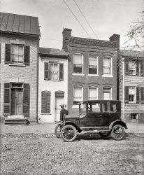 Circa 1924. "Ford Coupe at 'little house' in Alexandria, Virginia." National Photo owner Herbert E. French examining that city's Little House (a.k.a. "Spite House") on Queen Street, a narrow dwelling with a long history. View full size.