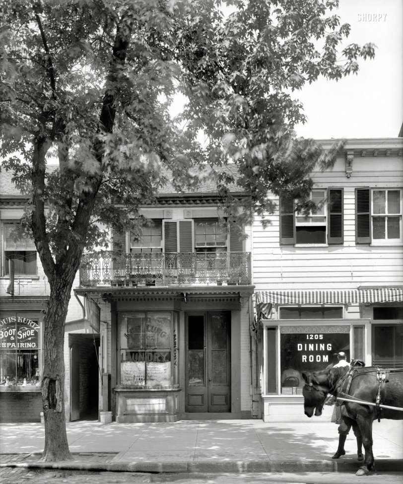 Washington, D.C., circa 1925. "The toy shop, 1207 New York Avenue." The former Apolonia Stuntz store (seen earlier on Shorpy here and here) where Abraham Lincoln is said to have bought toys for his son Tad, now the Lee Lung First-Class Laundry ("Bosom 6¢"). A scene so sun-dappled and languid, it's making us ... very ... sleepy. National Photo Company Collection glass negative. View full size.
