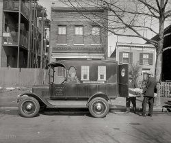 Washington, D.C., circa 1926. "Capital Awning Company -- Ford Motor Co." National Photo Company Collection glass negative. View full size.
Division of LaborI wonder where the other departments are located, and what they were.  Was there an awning department?  Seems like there should be.
Awning departmentcould probably be found on Shady Lane.
My childhood home had a big front porch and my parents bought awnings for all three sides of it. It was great to sit out there during a summer thunderstorm.
Wash tubsIt is interesting to see that each of the apartments to the left have their own galvanized wash tubs hanging on the porches. Guess I never thought about where people would have done their laundry in those days! 
And look at how dressed up the delivery men are! Thanks for all these great images that really give us a real sense of history.
Off KilterThe little house on the right appears to have some serious foundation issues, or maybe the builder had one leg shorter than the other.
Dig the mural on the truck. And so began the whole '70s van craze.
Shady is rightIt looks like they're loading bodies instead of awnings. With a few more under the blankets in the vacant lot.
FrugalThe well-dressed gent on the right appears to be the thrifty type judging by the rubbers over his shoes.  The practice is not unknown to me.
Faux WindowsFunny how the windows painted on the side of the truck are almost the right location and proportion for the front of the building.
Nice vanA Flivver with disc wheels is rare enough, but check out the decoration on the sides! Looks like a very colorful jalopy to me, complete with painted trees under the "windows"!
Also notice the useless but very decorative bows over the oval windows on the sides and the rear doors, and the way the curved reinforcing members add to the effect of the painted sides; it doesn't take much effort to imagine those are a fence in front of those brightly painted windows and trees. 
If there's an old car I'd like to see in full color, it would definitely be this one! 
Colorful flivverI couldn't help making a drawing of that old Model T and give it some color. I liked the results so much I thought I'd share it here. Hope you like it.
P.S.: No original photograph was injured in the making of this drawing. 
Was the driver  ...a blind man??
Yuk yuk.
Not the cheapestWhile the central office of the Capital Awning Company was at 1503 N. Capitol St., the Window Shade Dept. was located elsewhere.  (Buildings of this vintage survive in the 1500 block of N. Capitol street but none match the one shown here.)  I love the line, "Our customers talk loudly for us."



Classified Ad, Washington Post, Jan 13, 1915


Window Shades

Our awnings are made to last longer and guaranteed.  Not the cheapest, but the best; a few cents more.  Head rods strongly made; fast colors; prompt service; courteous treatment. Order now; no money required until delivery. Our customers talk loudly for us.  Capitol Awning Company, 1503 North Capitol st. Phone North 2959.


Awnings Complete the Home

Just sayin&#039;Are both of the houses really 2 stories?
The house on the right (83?) has a ~10' "antenna" on the front left. Any idea its purpose?
[The house on the right is farther from the street. - tterrace]
This was my grandfather&#039;s businessAnd he was also my namesake, having died just one day less than a year before I was born in 1947. At the time this picture was supposedly taken (1926) my father would have been 6 years old. I too go by "Wm. E. Russell," which is seen on the driver's door of the truck/van. My first "real paying" job was working at the Capital Awning Co., for 3 summers, directly out of high school, and while in college. Following my grandfather's death in 1946, my uncle became manager and ran the company while my grandmother was president. My father had little interest in "the family business". Identified as the "Window Shade Department," it's more likely venetian blinds, or possibly shades that the workers are handling.
In addition to awnings (residential and commercial) the company also provided massive party tents with flooring and heat (in winter) and did so for Washington's elite, including the Kennedys (JFK) in the backyard of their Georgetown house. 
 Sadly, with the advent of air conditioning and the increasing cost of awnings, the company went out of business in the early-to mid-80s. Prior to the expansive use of air conditioning, all of the grand apartment buildings' windows had awnings.
I certainly didn't wear a suit when I worked there. 
My older sister and I are the only remaining descendants, along with her daughter, my niece. This is the first time I have ever done a Google search on "The Capital Awning Company, Washington, DC," and is how I found this picture. What a delight! 
Tin Pan AlleyNice to see EvRuss' personal connection posted here, thanks!
I have to wonder, based on Hoperu's observation, whether the space between the Awning company building and the residences was called "Tin Pan Alley."
(The Gallery, Cars, Trucks, Buses, D.C., Natl Photo)