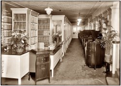 Another view of the Waldman's music store in Manhattan from 1921, showing records, listening booths and Victrolas. The inscription on the negative also says "N.Y. B'd Inst. Co." View full size. George Grantham Bain Collection.