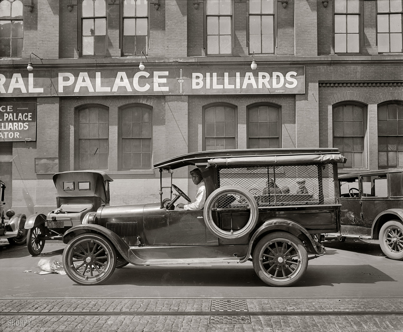 "Semmes Motor Co. truck, 1926." A Dodge truck outside the Grand Central Palace pool hall in Washington, Pennsylvania Avenue and Seventh Street N.W. National Photo Company Collection glass negative. View full size.