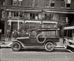 Washington, D.C., 1926. "Semmes Motor Company. Barber &amp; Ross truck." National Photo Company Collection glass negative. View full size.
ReflectionsWow! Beautiful building reflecting in the hardware store windows. They sure don't make them like that anymore.
Trash LoversI can hear their radio ads now: "Let Barber &amp; Ross fulfill all your wastebasket wishes." They also appear to be really into crocks.
My father worked for Barber &amp; RossMy father, Marty, worked as a salesman for Barber &amp; Ross from the mid-50's til the early-70's.  This was after they expanded into the building supply and millwork business.
My family are DC area natives from the 1870's.  Wilson and McKinley Tech graduates.  My father graduated from GW.  
Most of my childhood and early adulthodd was spent in Silver Spring and Kensington MD.
This is a great site.  I wish my folks were alive to see it.
(The Gallery, Cars, Trucks, Buses, D.C., Natl Photo, Stores & Markets)