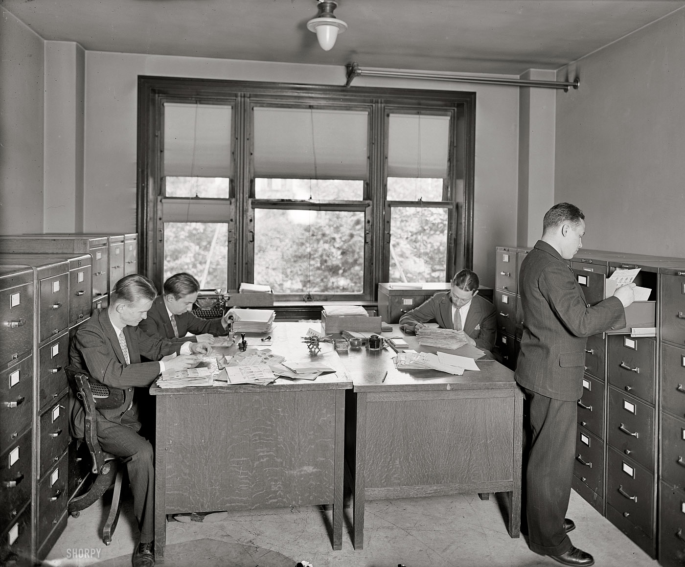 Washington, D.C., circa 1925. "Bureau of Identification, Department of Justice." National Photo Company Collection glass negative. View full size.