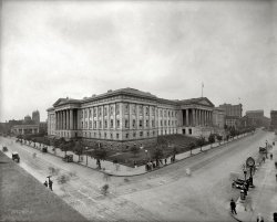 The U.S. Patent and Trademark Office in Washington circa 1920. Which, after a zillion-dollar makeover, is now the Smithsonian's National Portrait Gallery and Museum of American Art. National Photo Co. glass negative. View full size.
They have the patent on tilted lawnsCan anyone explain why that one section of the yard is inclined? Is there some sort of room under it?
[A good question. There were a number of roof and basement skylights covered over after the building was electrified. Or it could have been a driveway ramp. - Dave]
Dancing with the LincolnsLincoln's second inaugural ball took place in this building, in the gallery on the east side (not visible in this shot). It's a great 19th century public space.
Kogod AtriumAhh... The old Patent Office is one of the great architectural buildings in the district.  The recent renovations included covering over the interior courtyard into a fantastic covered atrium. Visible on the right of this photo is the grandest brick edifice in D.C.: the old  Pension Bureau, now the National Building Museum. I strongly recommend both sites to any visitors to the area.
 Also to the right of the photo is the now razed Barrister Building.

 Washington Post, Feb 13, 1910

 Office Structure Begun
Foundations for another nine-story office building for Washington are being laid at 635 F street northwest, and within the next week or two the public will be able to obtain a general idea as to how large the structure will be when it is completed.  The building will be called the Barrister building, and will be a modern fireproof structure, with a 29-foot frontage and a depth of 120 feet. ...

Smithsonian"Which, after a zillion-dollar makeover, is now Smithsonian's National Portrait Gallery and Museum of American Art."
At least they didn't raze the building to build a parking lot...
The ghosts are cool, and there's a lot of them in this one!
[Probably would have been harder to get a $250 million appropriation for a parking lot. - Dave]
Is that a Horse Drawn Carriage sans horse?Behind the clock on the left, is that a Horse Drawn Carriage without a horse, or is that an automobile that would be considered an antique even in 1920?
I mean, those are solid rim wheels!
[That's a runabout. And I'd imagine the four legs belong to a horse. - Dave]

I&#039;m disoriented!I'm confused about which corner I'm looking at. Where was this photo taken from? There is a ledge of some kind in the lower left corner. Is that a window sill? Is it a roof? Also, at the end of the street heading off to the right there is a huge building that looks kind of like the National Building Museum. And what are the minaret-looking towers off to the left?
What would be great  is if there was a way to "tag" DC landscape photos like this one to tell us what else is in the picture. Thanks!
[On the left is Ninth Street heading north; to the right is F Street heading east toward the Pension Office, now the National Building Museum. Click below to zoom. - Dave]

I just can&#039;t help myself!Under the tilted lawn is the root cellar where they keep their possum.
(The Gallery, D.C., Natl Photo)
