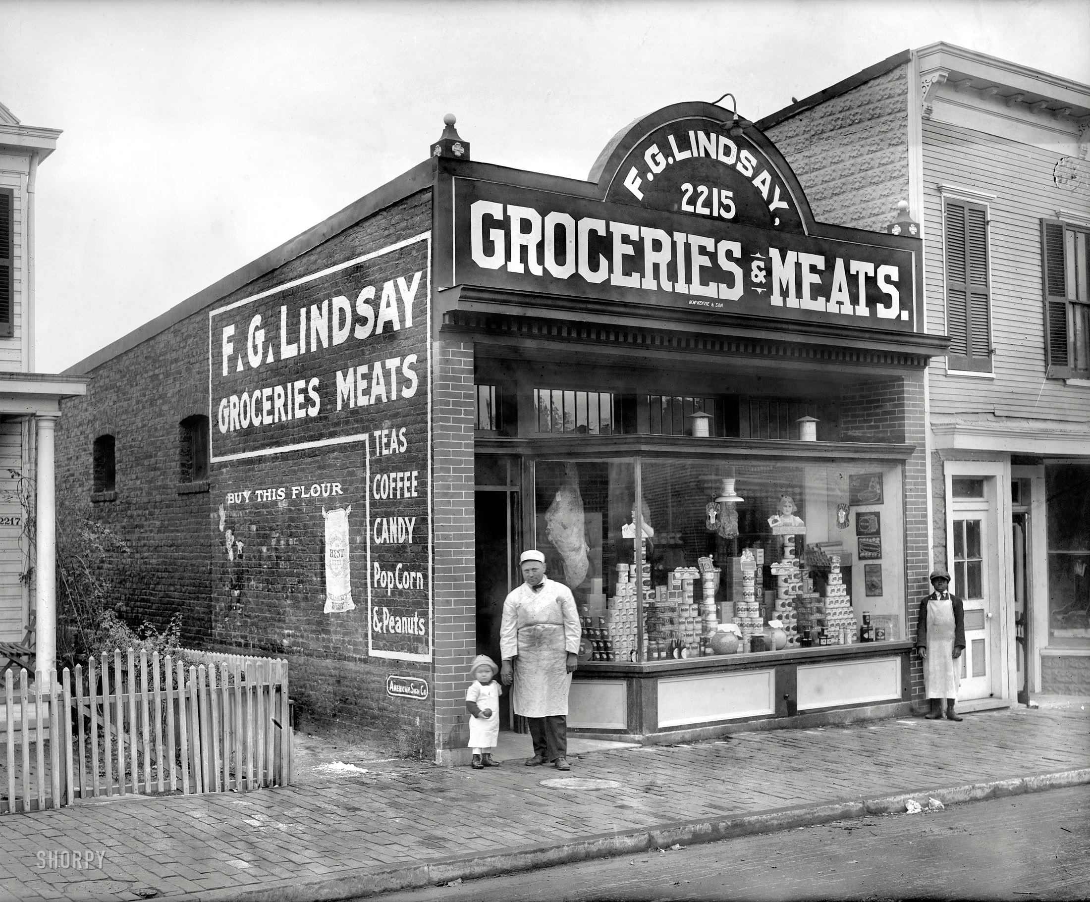 Washington, D.C., circa 1925. "F.G. Lindsay store front, Anacostia, 2215 Nichols Avenue." Exterior of the grocery seen here. National Photo Co. View full size.