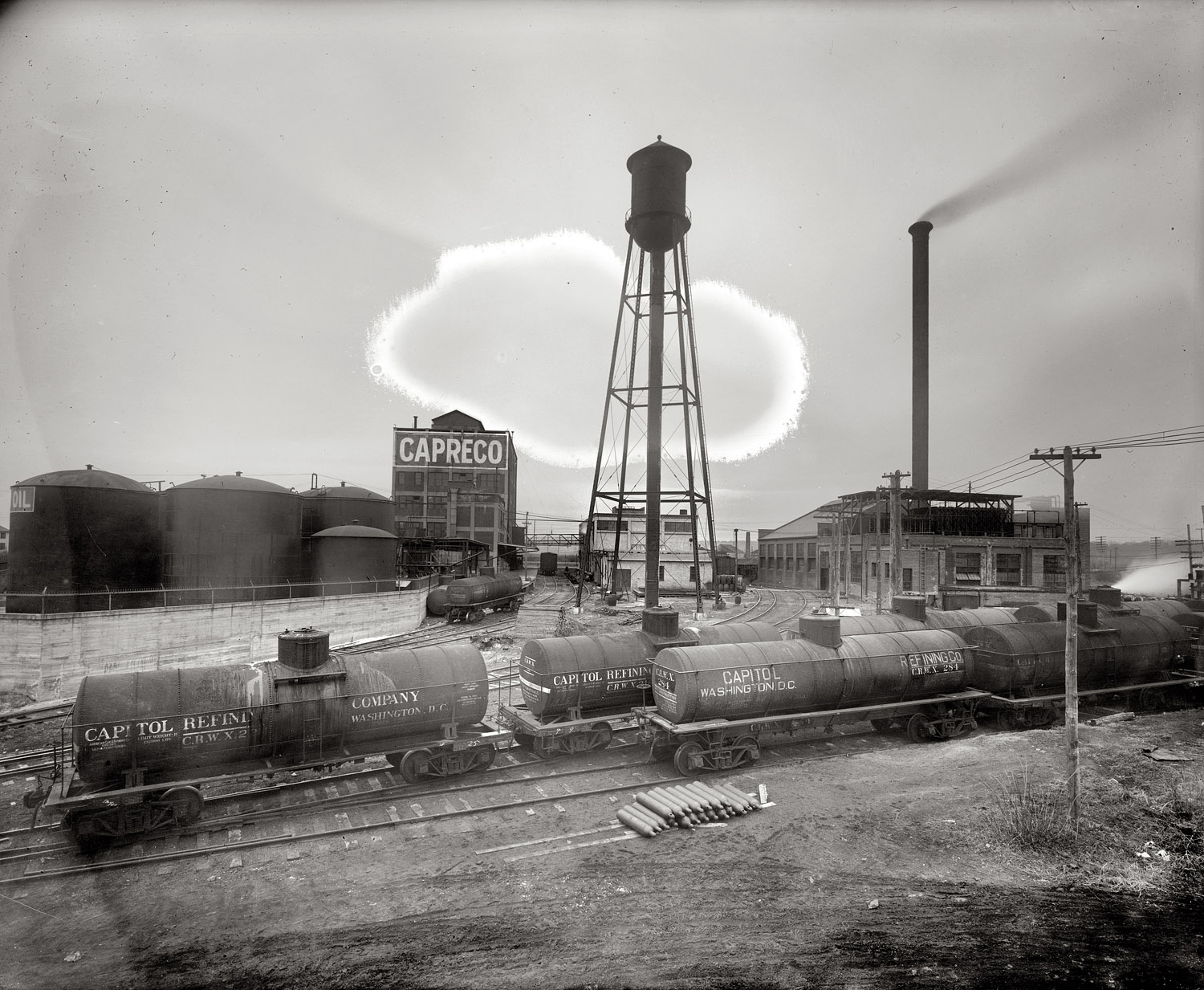 A glimpse at the industrial side of Washington circa 1925, labeled "Capitol Refining Co. plant." This tank farm, where the Pentagon stands today, was described at the time as being in "Relee, Alexandria County, just south of the highway bridge." National Photo Co. Collection glass negative. View full size.
