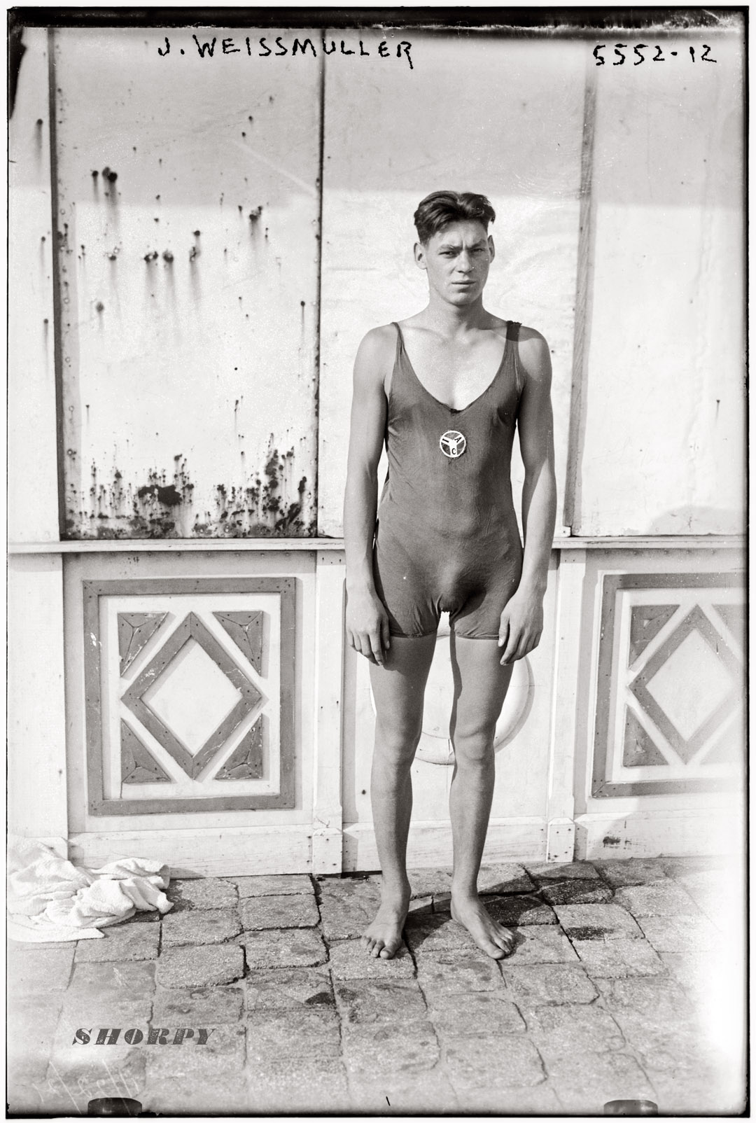 Johnny Weissmuller in an Illinois Athletic Club swimsuit circa 1922, prior to winning five Olympic gold medals in 1924 and 1928. Before becoming Tarzan and signing a movie contract with MGM in 1932, Weissmuller was a spokesmodel for BVD swimwear. George Grantham Bain Collection. View full size.