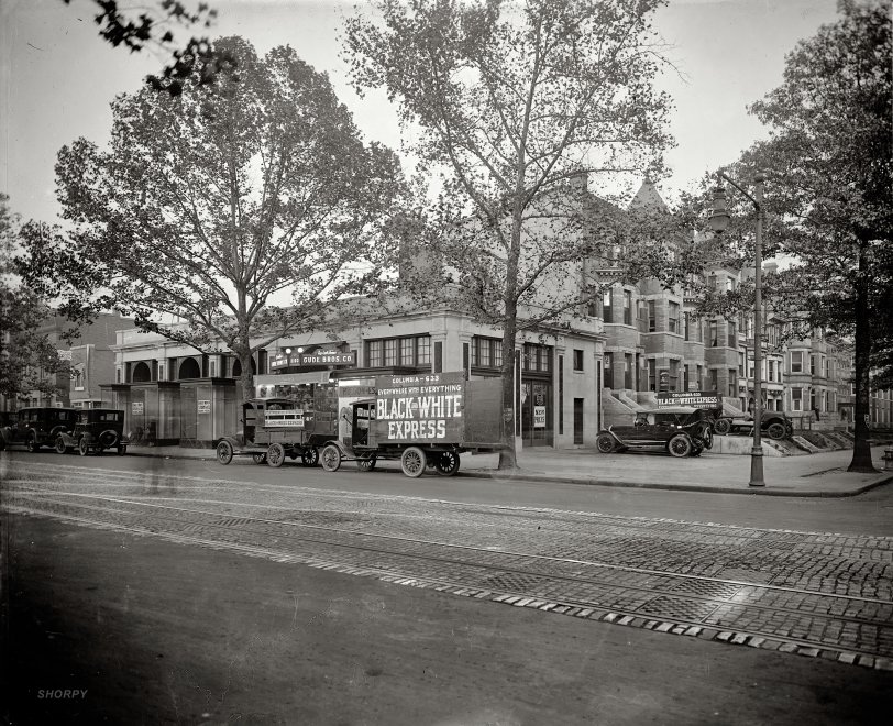 Washington, D.C., circa 1926. "I.C. Barber Motor Co., 14th &amp; Irving Streets N.W." Here we have everything from a Hudson-Essex car dealership to moving vans to a florist to "scalp specials." And not only ghost pedestrians in this time exposure but a ghost car! Also note the use of trees as 1 Hour Parking signposts. National Photo Company Collection glass negative, Library of Congress. View full size.
