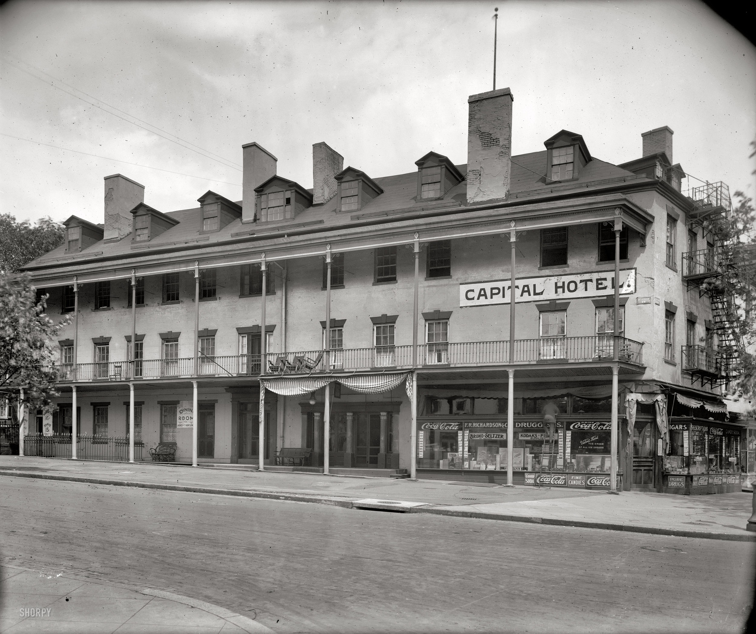 Washington, D.C., circa 1920. "Old Capital Hotel, 3rd and Pennsylvania N.W." When the place was torn down in 1926, the sign had changed from "Capital" to "Capitol." Originally the St. Charles Hotel, it had a colorful (at times appalling) history going back to 1813. National Photo Co. glass negative. View full size.
