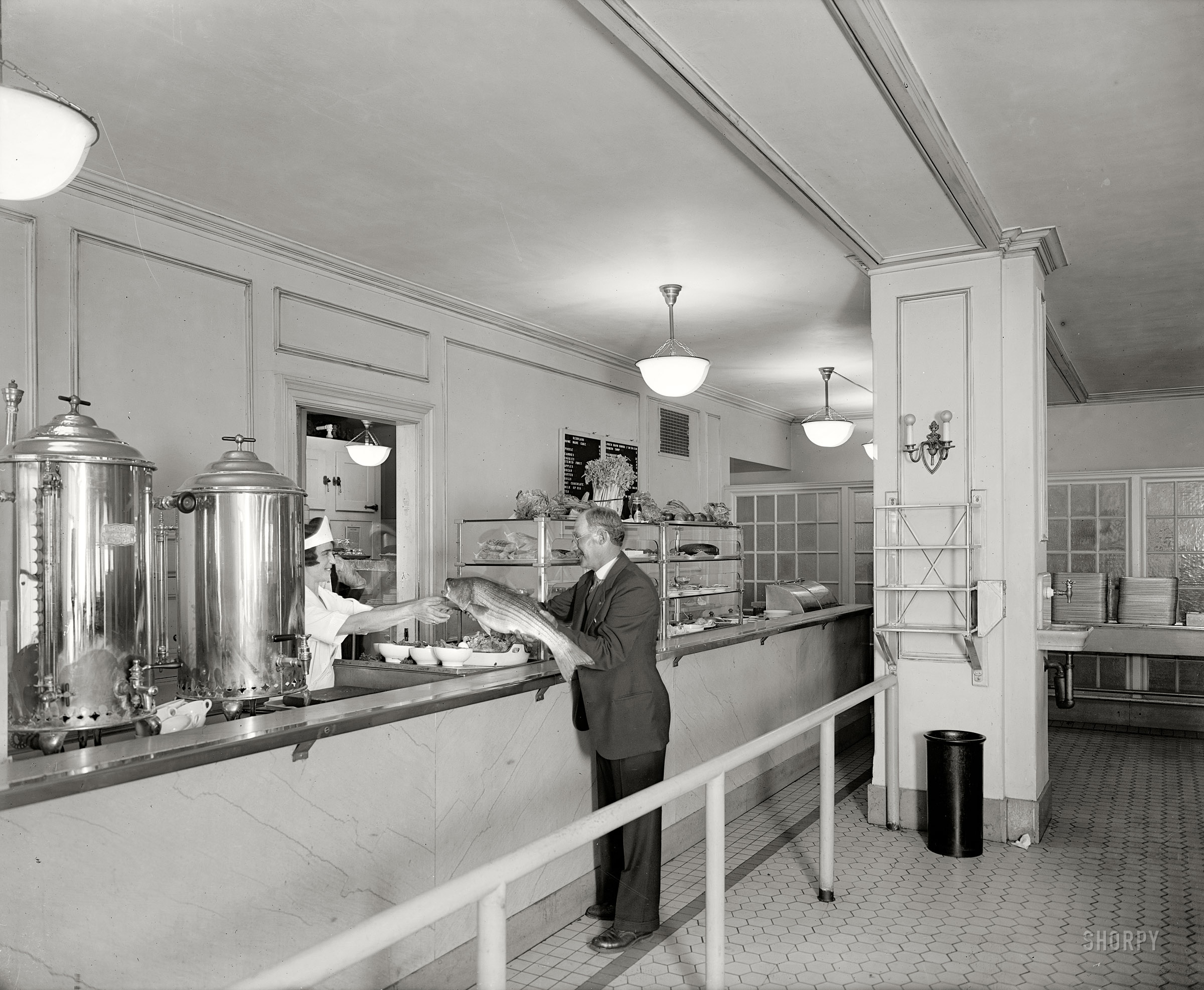 Washington, D.C., circa 1928. "Chesapeake & Potomac Telephone Co. cafeteria showing presentation of rockfish." A caption that raises more questions than it answers. National Photo Company Collection glass negative. View full size.