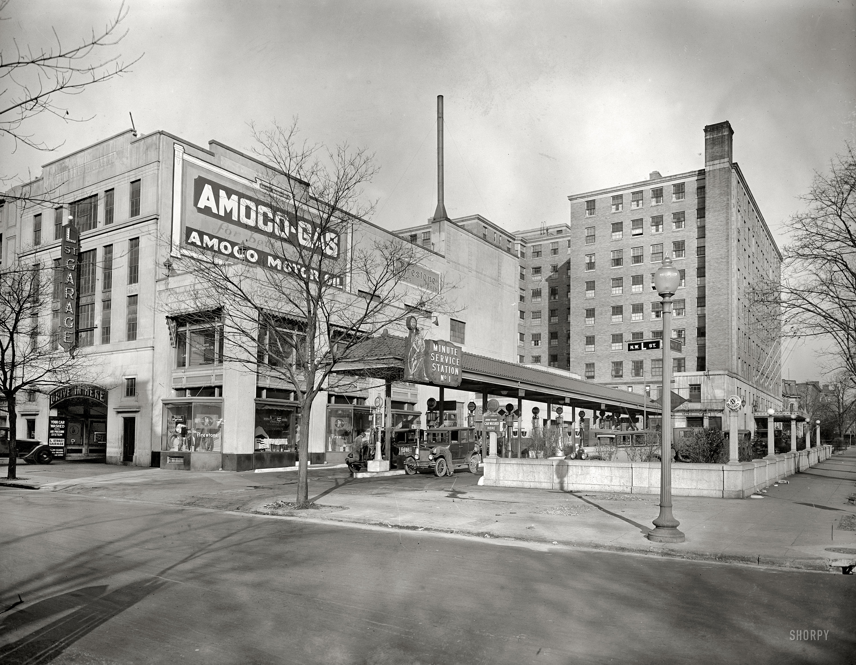 Washington, D.C., circa 1928. "Washington Accessories store, L Street N.W." The service station we saw last year in this view from 1925, before the streetlamp sprouted on the sidewalk. National Photo Co. glass negative. View full size.