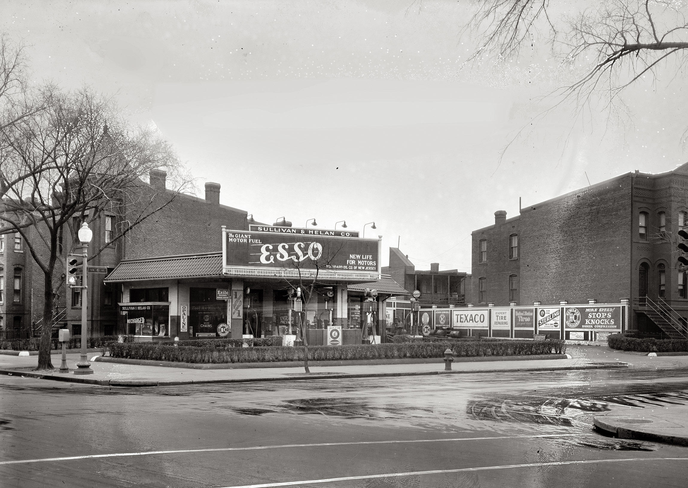 Washington, D.C., circa 1928. "Hedges & Middleton. Sullivan & Helan Co." Service station at Sixth Street and Rhode Island Avenue N.W. Note the traffic light with bottom lens labeled "GO." View full size. National Photo Co. glass negative.