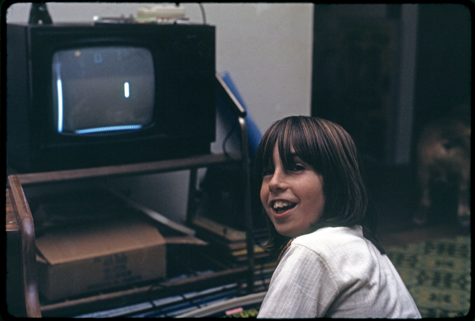 My nephew David and Pong, December 25, 1976. Man, lookit them graphics! From my underexposed Kodachrome slide.