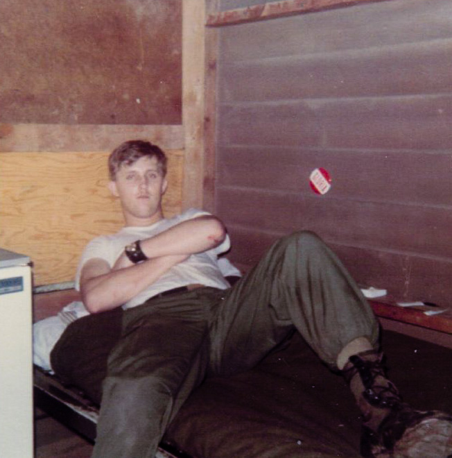 This is another barracks photo of my brother Randy. The pin on the wall had his wife's name on it, and follows him around in many of his 'Nam photos. View full size.