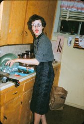 I found this image in a box of slides I purchased at a thrift store. All I know about it is that the slide mount says "Dinah - Kitchen". I don't have a date or a location but it's a wonderful slice of mid-century Americana. View full size.