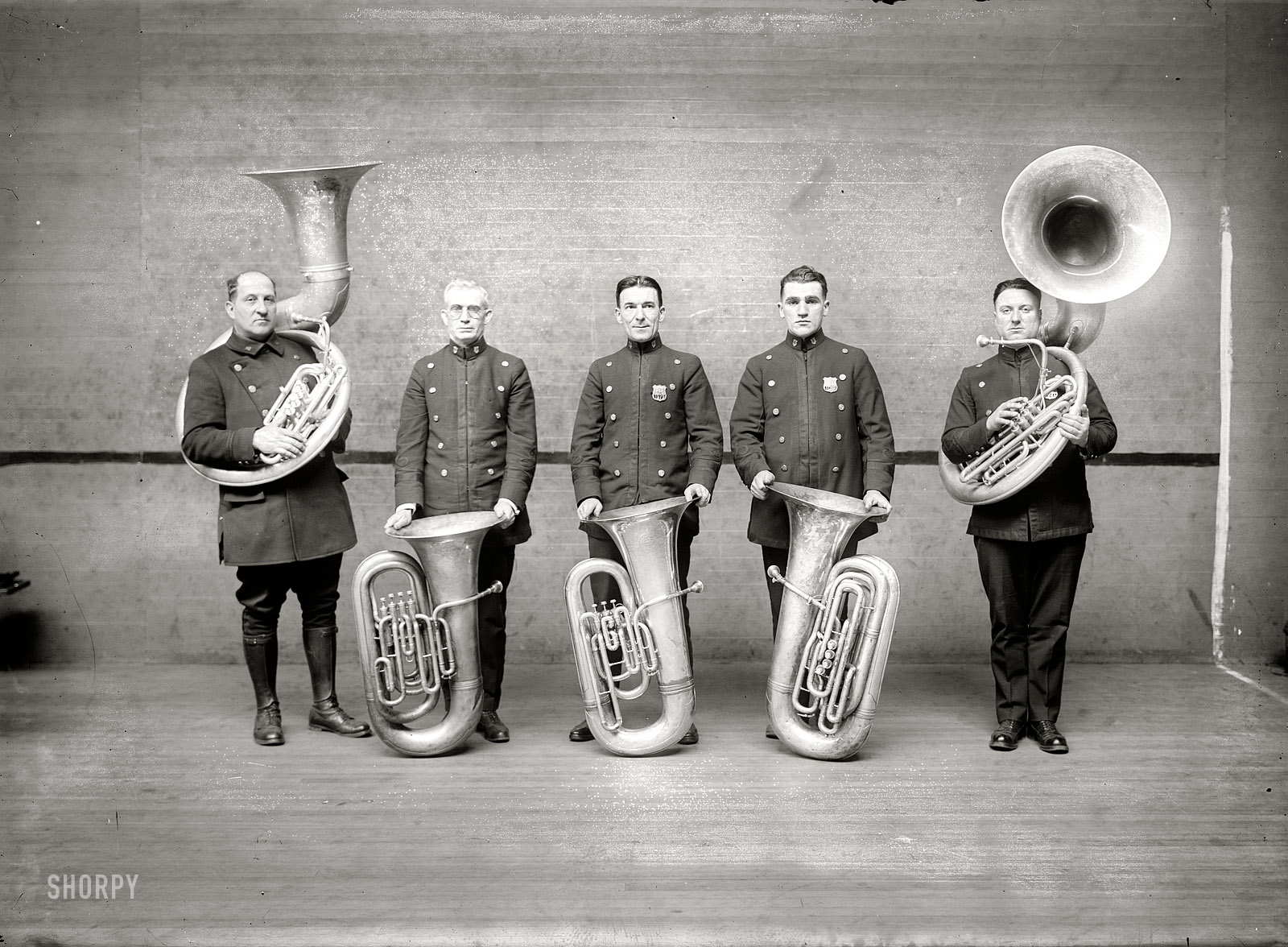New York circa 1915. "Police tuba players." Shorpy is being beamed to you this week from on the road. (So far today from two WiFi enabled McDonald's parking lots along I-95. Posts and updates may be even more erratic than usual!) 5x7 glass negative, George Grantham Bain Collection. View full size.