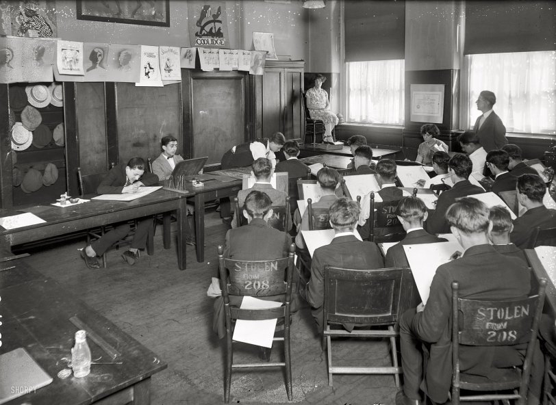 New York circa 1925. "Art Class (commercial)." The certificate or diploma on the wall bears the name of East Side Continuation School. View full size.
