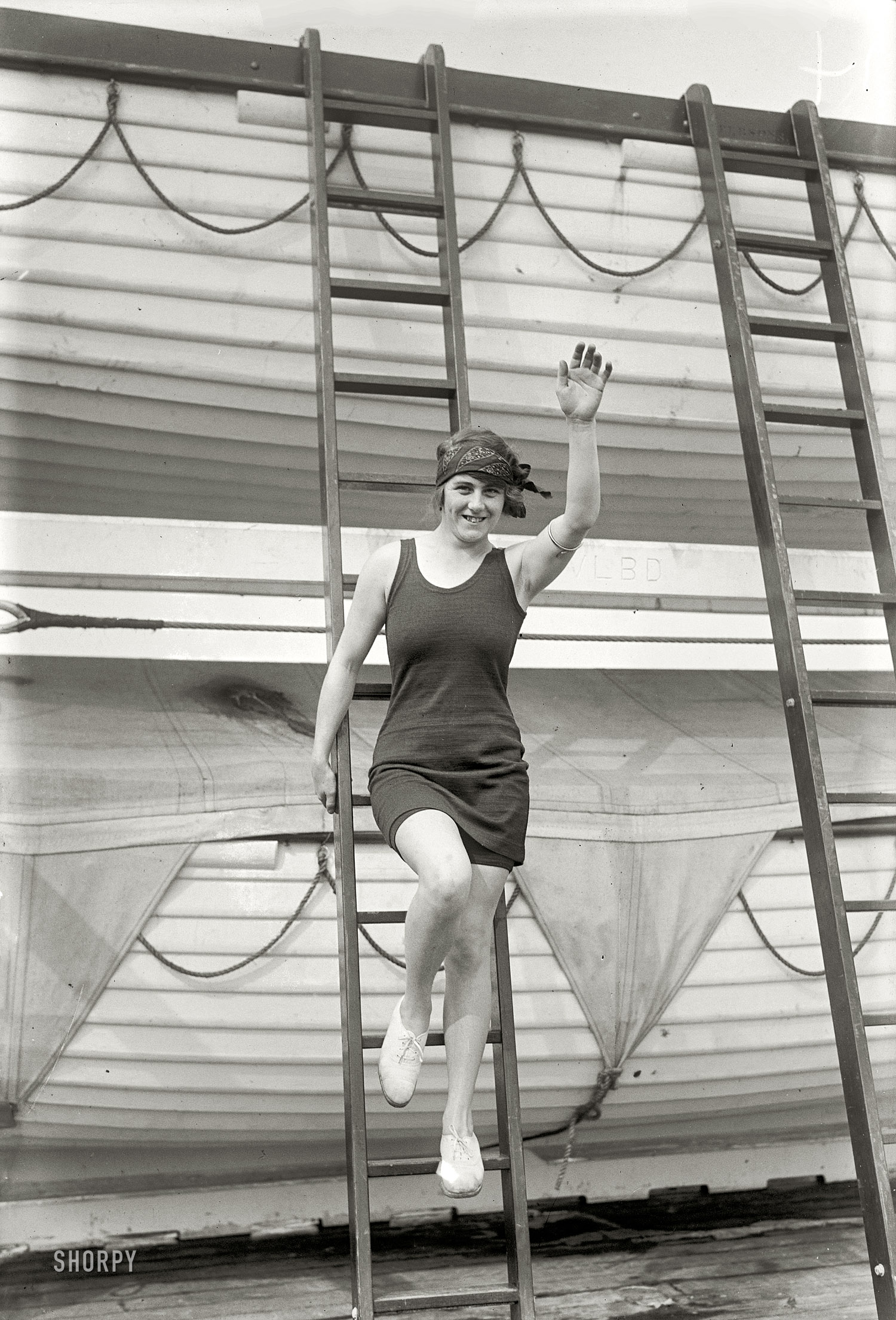 September 1925. "Hilda James." The British swimmer and Olympic medalist shipboard in New York Harbor after retiring from amateur sports to "preside over the pool in a new transatlantic liner." Bain News Service. View full size.